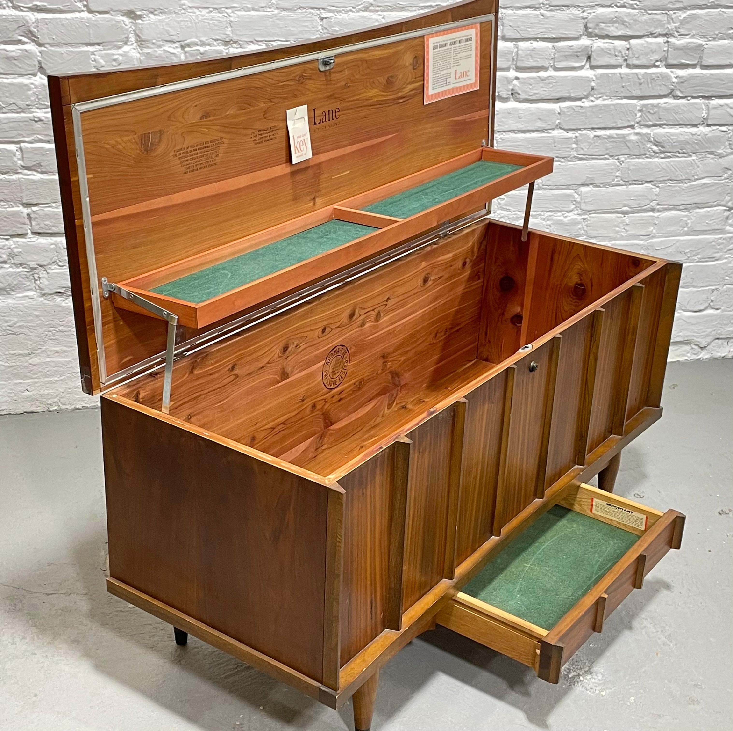 Mid-Century Modern walnut Storage Chest with hidden drawer by Lane Furniture, circa 1960s. Perfect for storing linens, blankets, off-season clothing or souvenirs. This fabulous chest makes the perfect addition to any modern interior and looks great