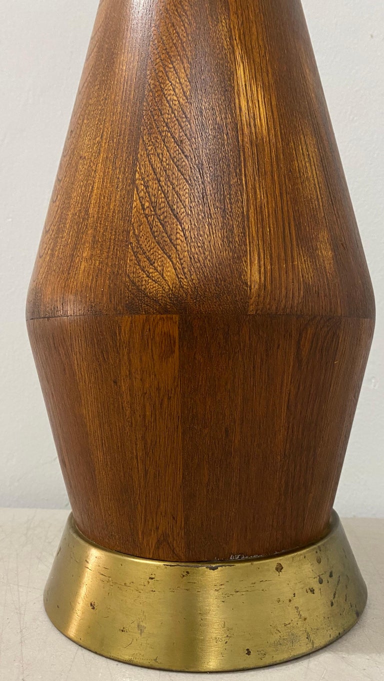 Mid-Century Modern walnut table lamp, circa 1960

Classic midcentury table lamp

No shade. The harp and socket are not original to the lamp (as found)

Measures: 7