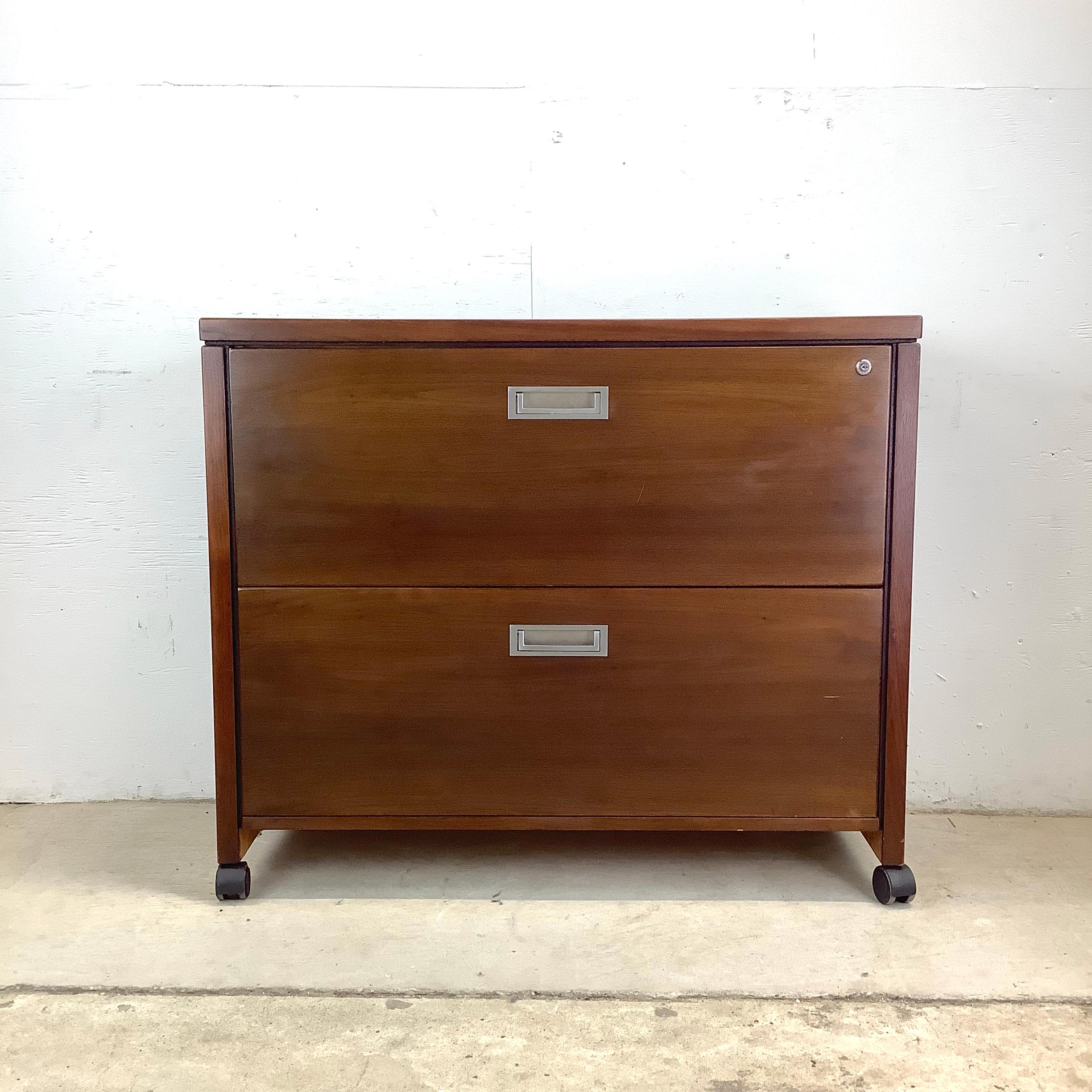 This vintage modern filing cabinet from Springer Penguin offers a perfect balance of retro charm and sturdy utility. Its clean lines and walnut wood veneer bring a sense of warmth and character to your workspace.

While its style nods to mid-century