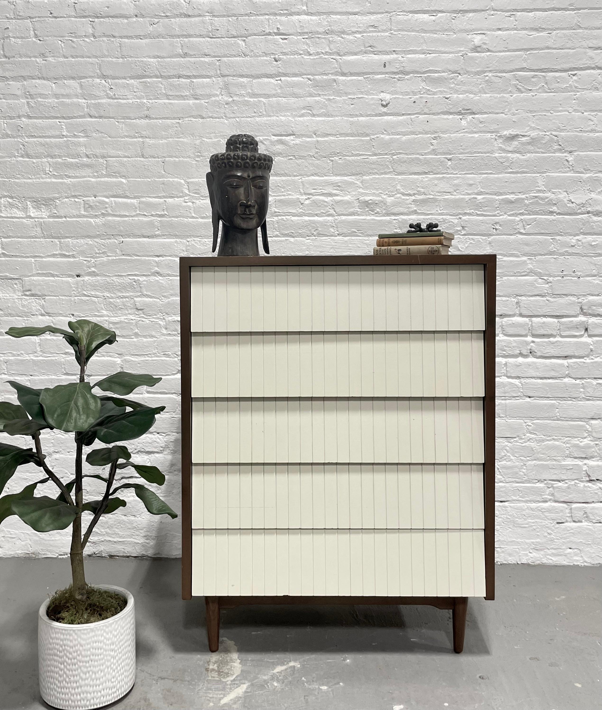 Mid Century Modern Walnut + White Dresser by Lawrence Peabody for Child Craft, c. 1960's. Five deep and spacious drawers offering plenty of storage space. Laminate woodgrain surface. Lovely vintage condition wear from age and use; see pictures for