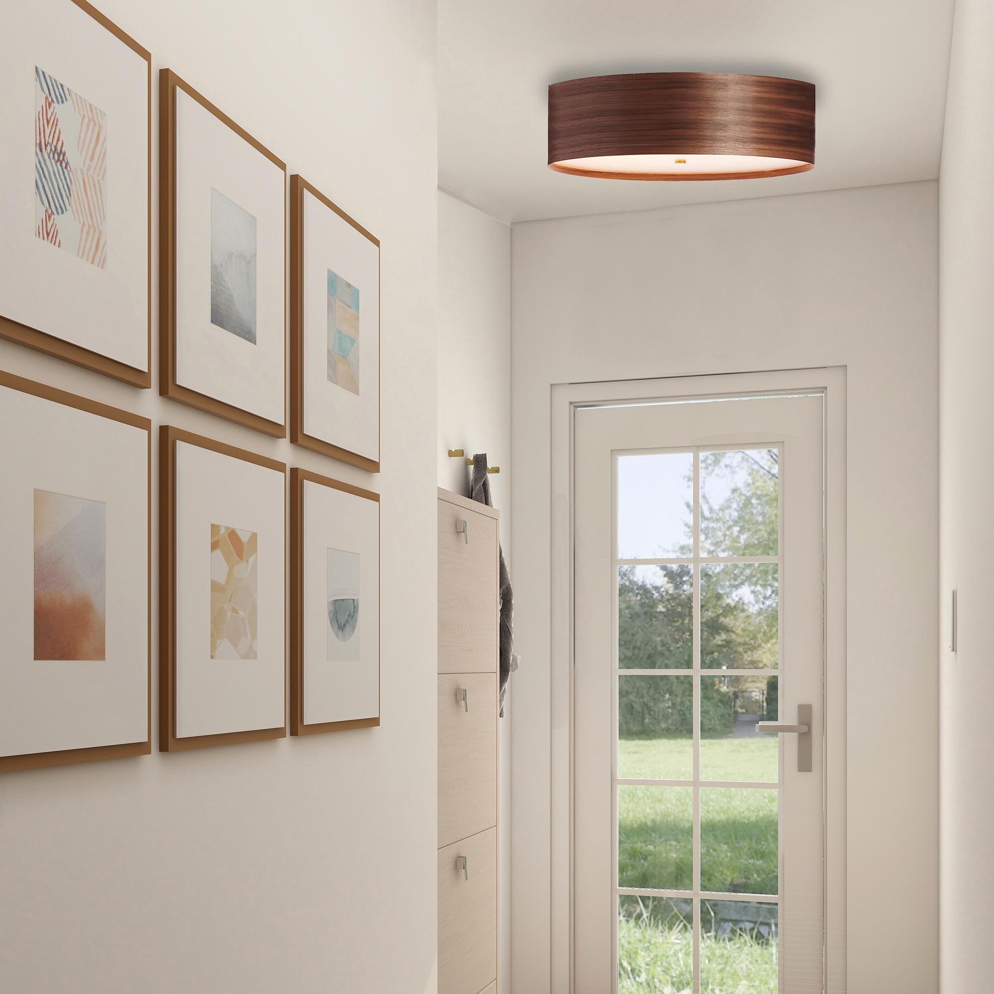 GORIN is a contemporary, Mid-Century Modern light fixture with a Scandinavian composition. This is a minimalist luxury wood veneer flush mount design and can be exhibited in living rooms, offices, and conference rooms. Walnut is prized by designers