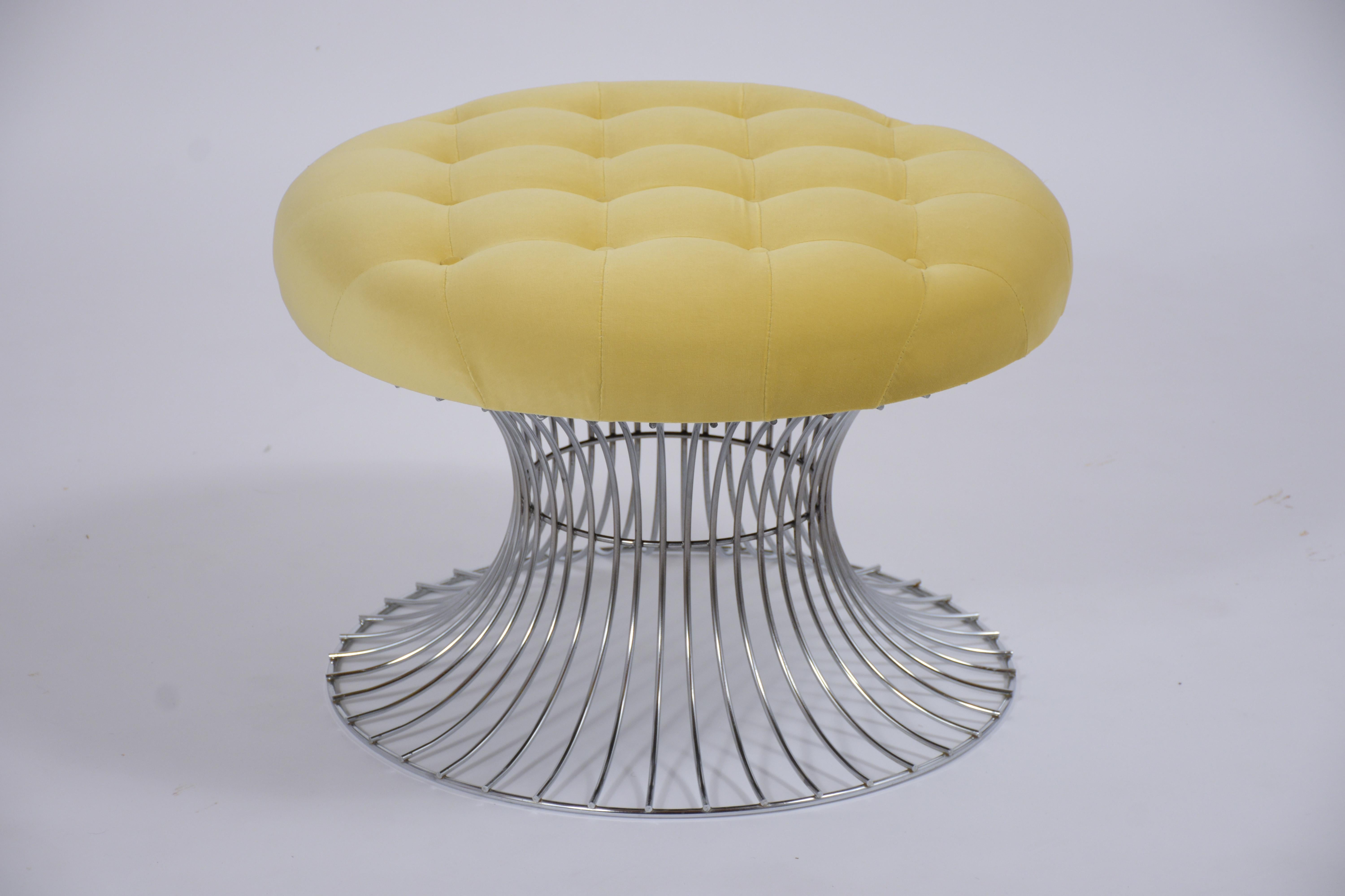 This vintage tufted stool is in great condition, has a solid steel frame, and has been newly upholstered in a yellow velvet fabric. The fabulous stool features a new tufted round comfortable seat cushion with top-stitch and single piping details.