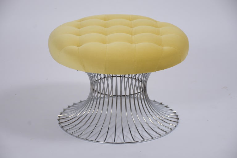 This vintage tufted stool is in great condition, has a solid steel frame, and has been newly upholstered in a yellow velvet fabric. The fabulous stool features a new tufted round comfortable seat cushion with top-stitch and single piping details.