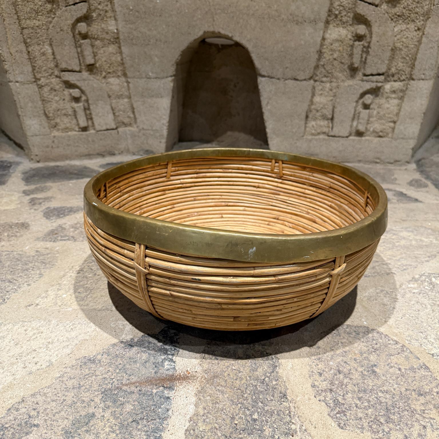 For your consideration,  a large rattan and brass centerpiece bowl, c.1970.  Mid Century Modern weaved basket with brass trim by Gabriella Crespi  (Italian 1922-2012), 

Dimensions: 18.25 diam x 7 H

Please visit take a look at our listings, we have