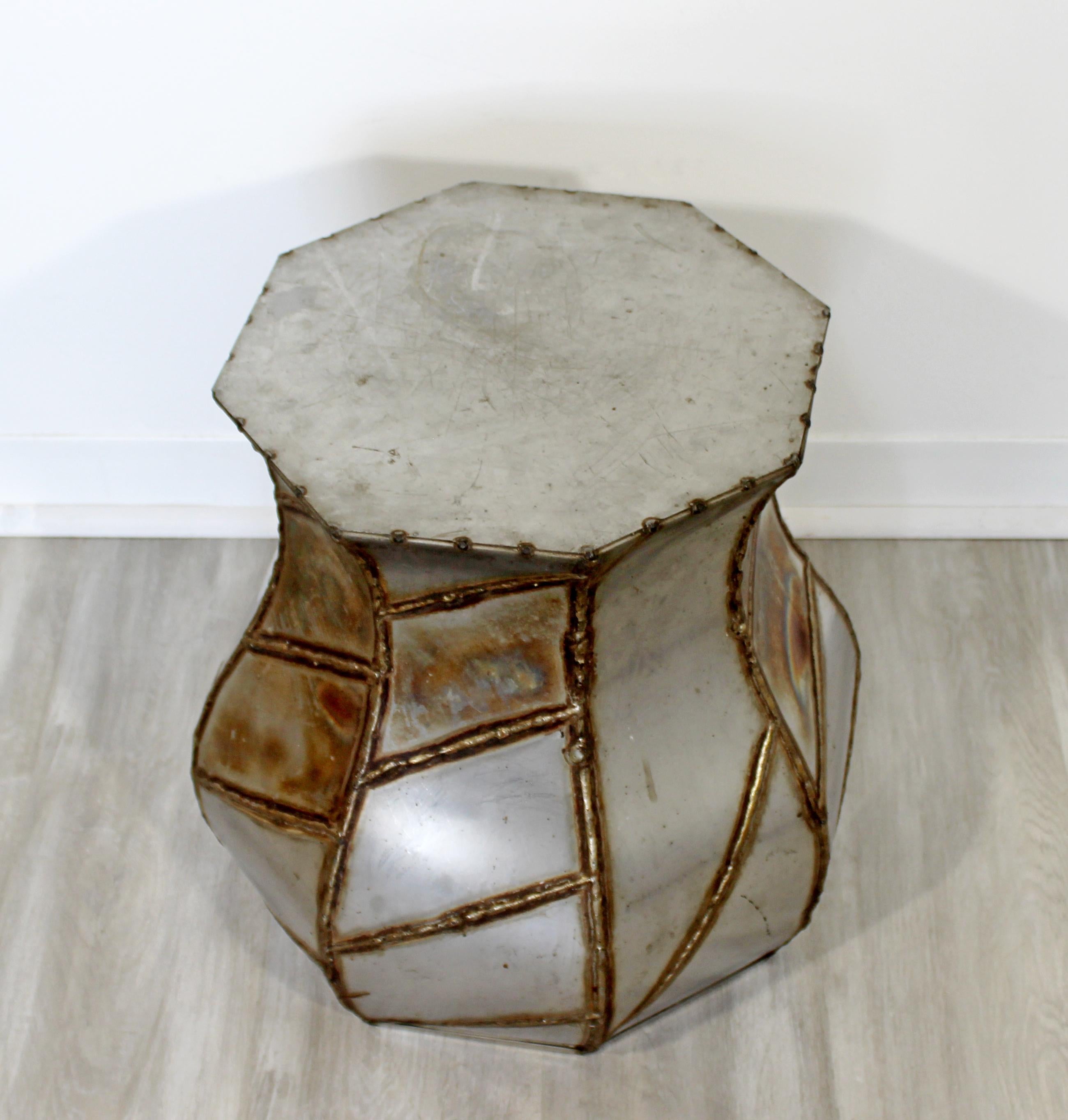 For your consideration is an appealing, Argente style, welded metal, drum side or end table, circa the 1970s. In excellent condition. The dimensions are 14.5