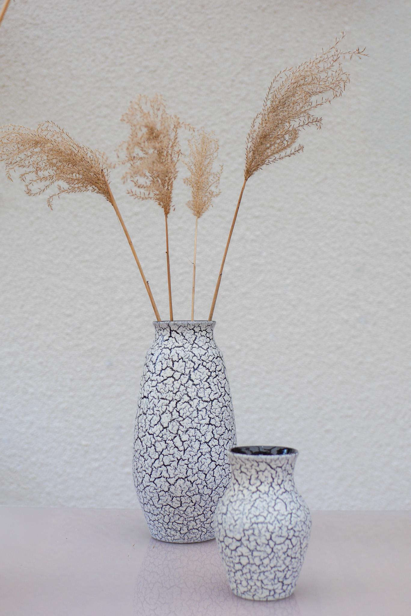 Matching Pair of 1970s “Cortina” Craquele Ceramic Vases by Jasba, West Germany

A striking pair of sculptural ceramic vases from the Cortina series, designed and produced by Jasba Keramik in West Germany during the 1970s. These pieces beautifully
