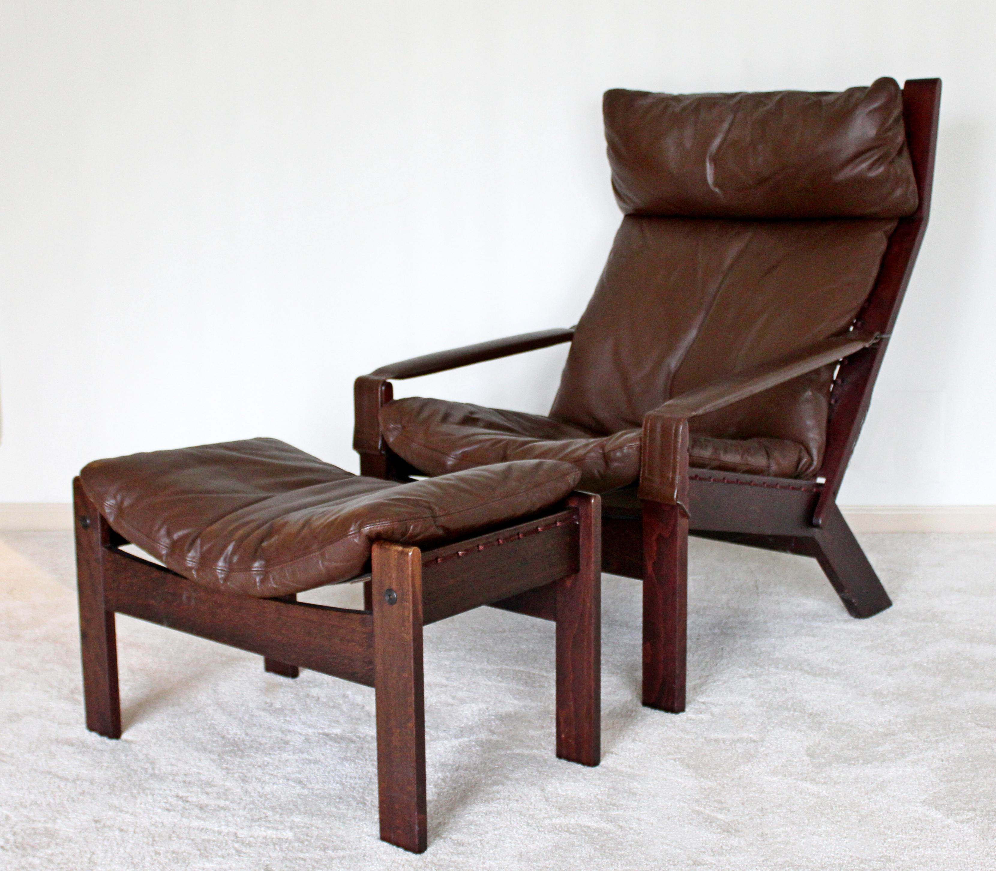 For your consideration are a marvelous, sculptural lounge armchair and matching ottoman, with a brown leather upholstery, by Westnofa, made in Norway, circa the 1960s. In very good condition. The dimensions of the chair are 26