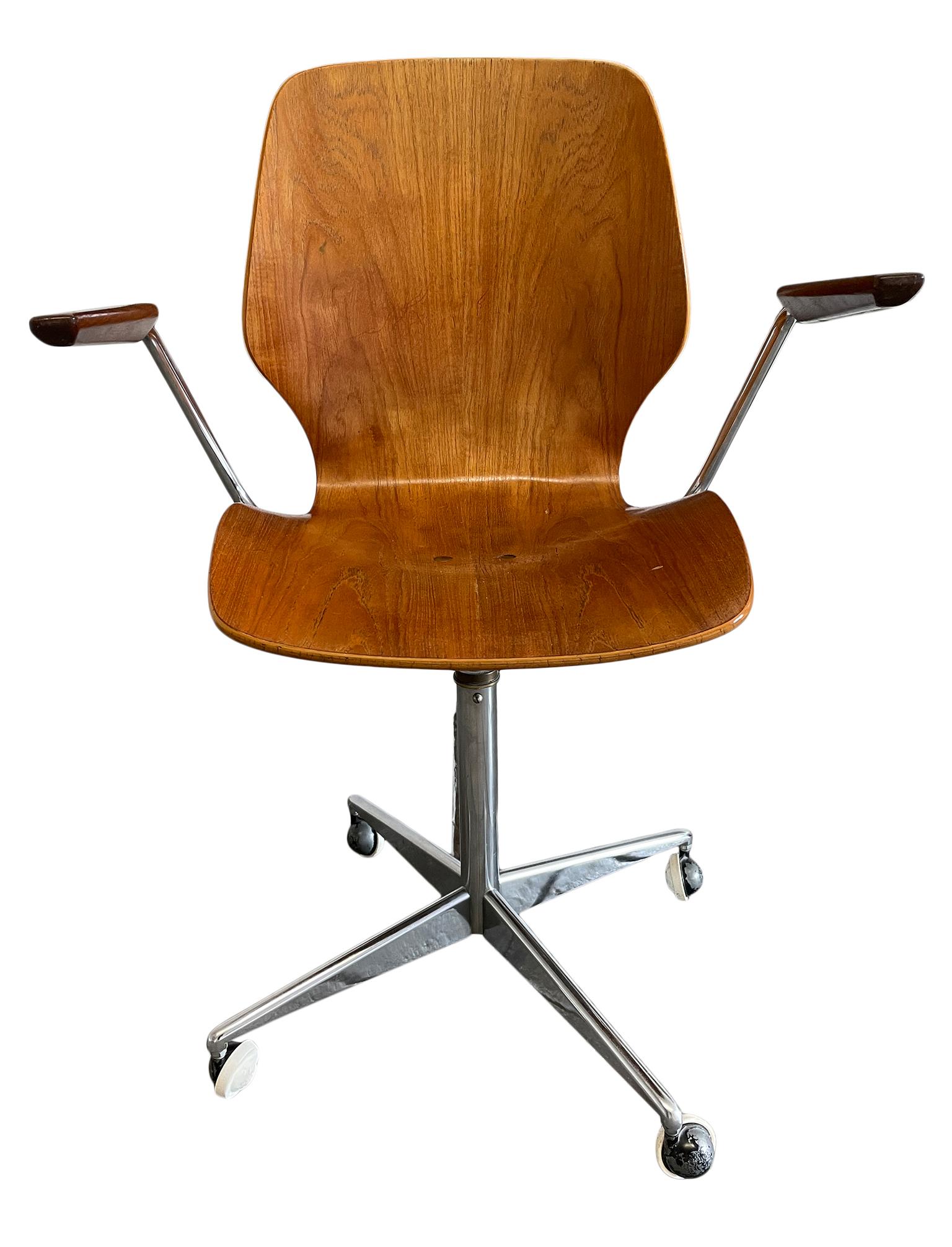 Mid-Century Modern Westnofa teak office chair minimalist. Bent wood seat adjustable chrome base with casters. Minimalist arm rests chrome and teak. Very clean chair. Labeled Under seat. Made in Norway. Very clean chair. Seat height is manually