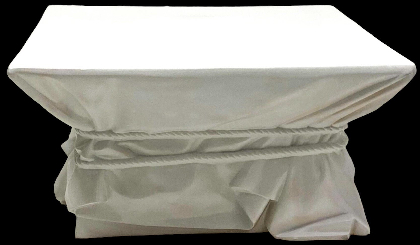 This is a mid-century modern white cast fiberglass John Dickinson style coffee table. It has the iconic faux drape and rope motif that is associated with many Dickinson pieces. It is in very good condition and unmarked.
