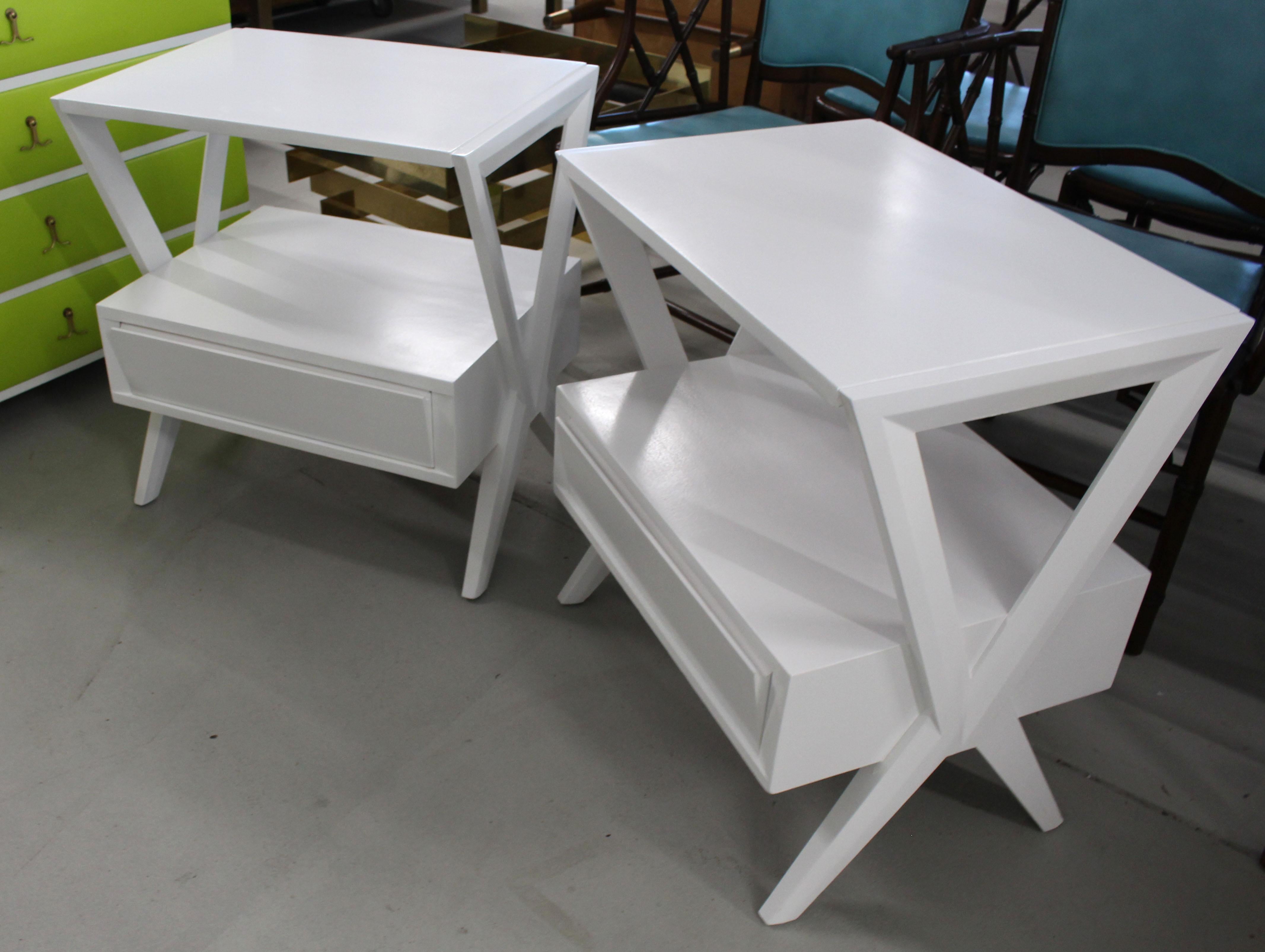 Mid-Century Modern white lacquer on drawer end side tables or nightstands.