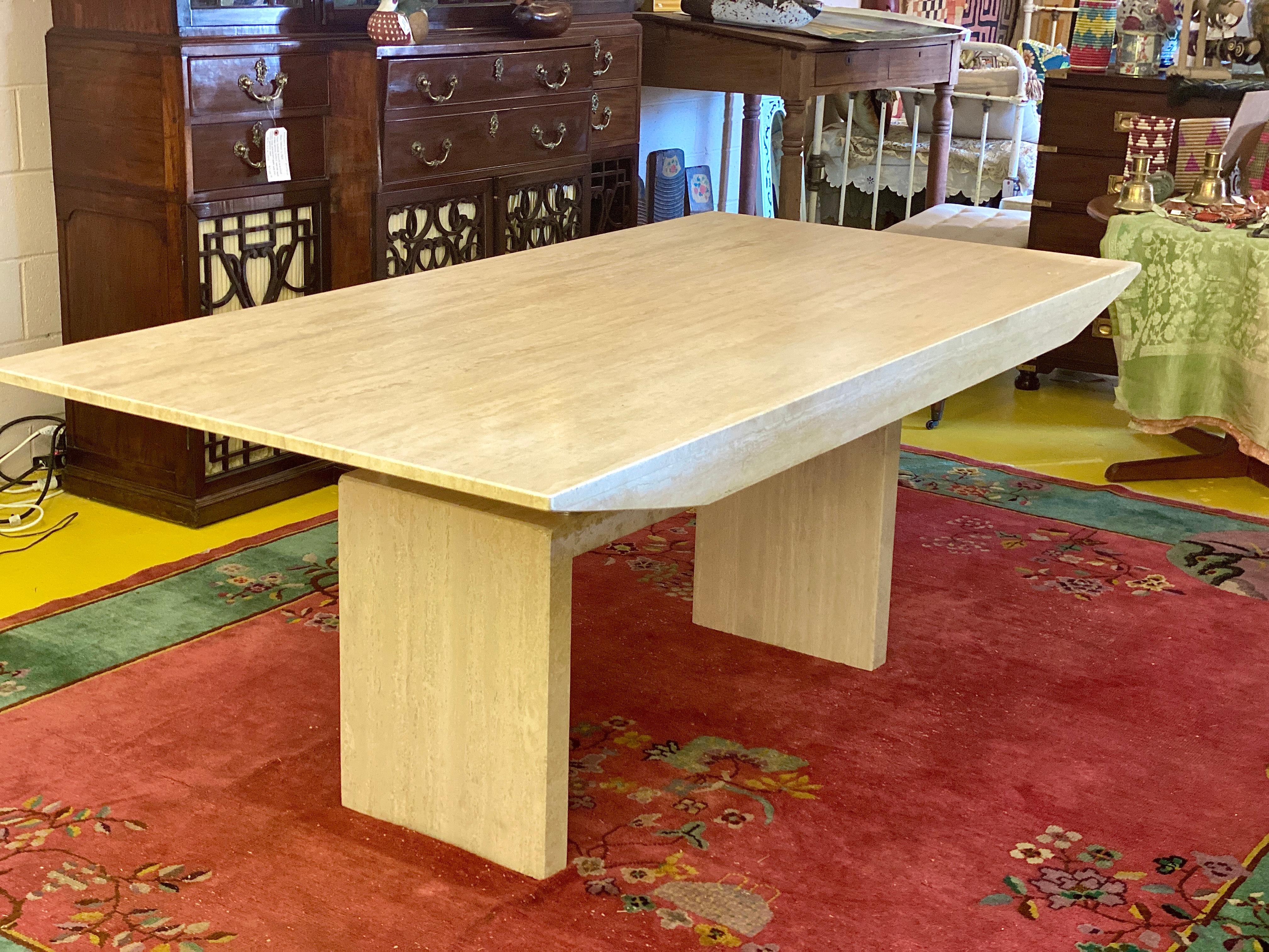 This beautiful Mid-Century Modern white marble dining table has an incredible sculptural form and striking luster. It has a wonderfully smooth feel. The 3