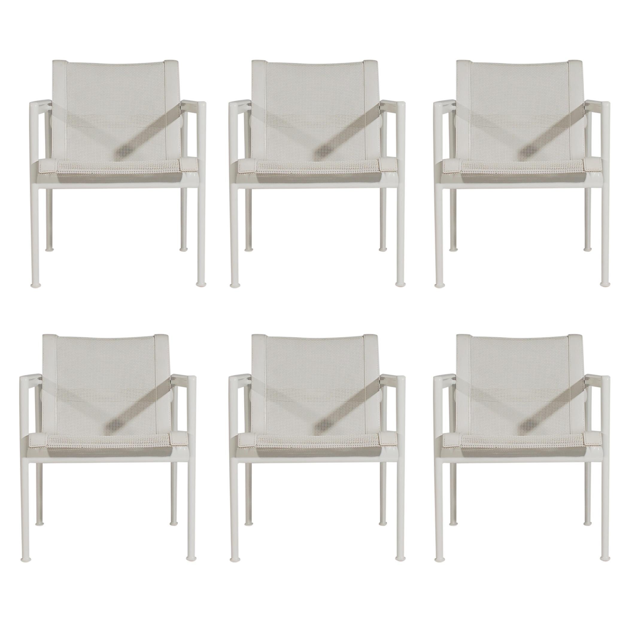 A complete outdoor dining set designed by Richard Schultz and produced by Knoll. The set includes 6 armchairs and one rectangular dining table. Features aluminum framing, white sling seats, porcelain tabletop. Table measures: 38 x 60 inches.