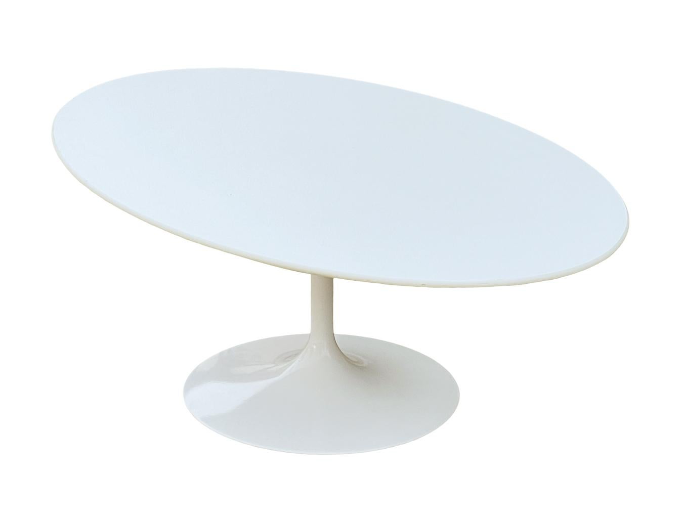 An iconic classic designed by Eero Saarinen and produced by Knoll. It features a white top with white base. Excellent overall condition. Manufactures stamp.