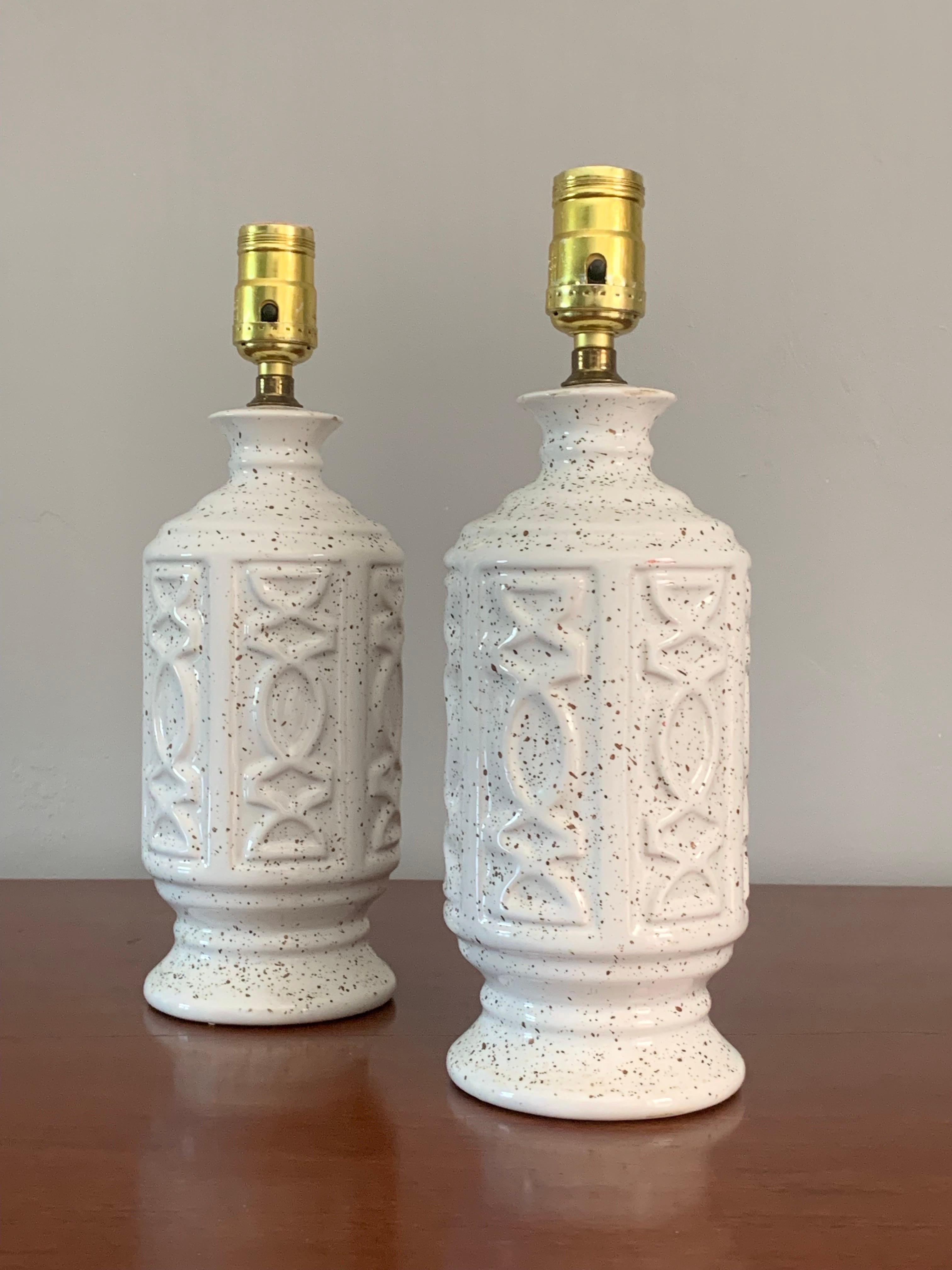 Petite and cute. This pair of ceramic table lamps can add a brightness and fun to any room. Clean design with some light flair. Smaller in stature than most 1950s lamps so you can have an authentic mid century lighting option with out the towering
