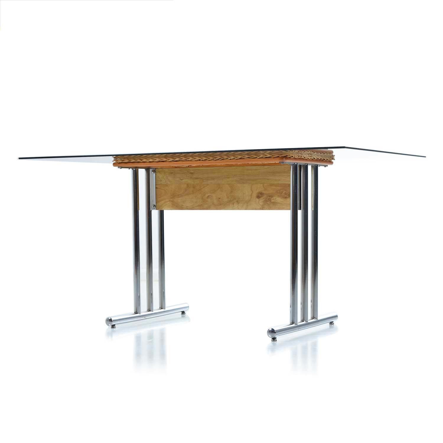 Chrome, wicker, and smoked glass… it doesn’t get much more 1970s than this! The 1970s were all about flare and personality and this table captures it all, smartly. The hand polished tubular chrome steel absolutely sparkles. The modern metal material