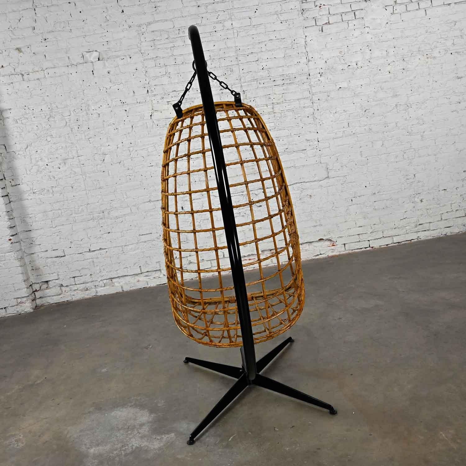 20th Century Mid-Century Modern Wicker Rattan Hanging Basket Chair & Black Painted Stand