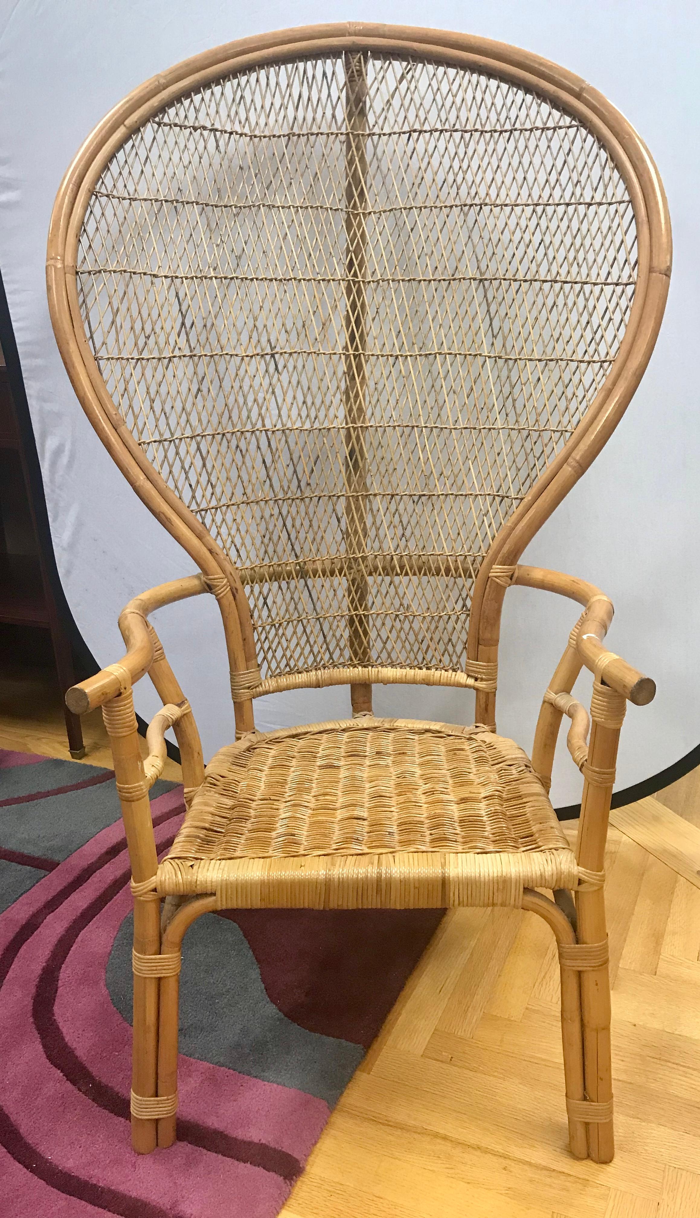 Coveted mid-century modern large wicker and rattan peacock chair.