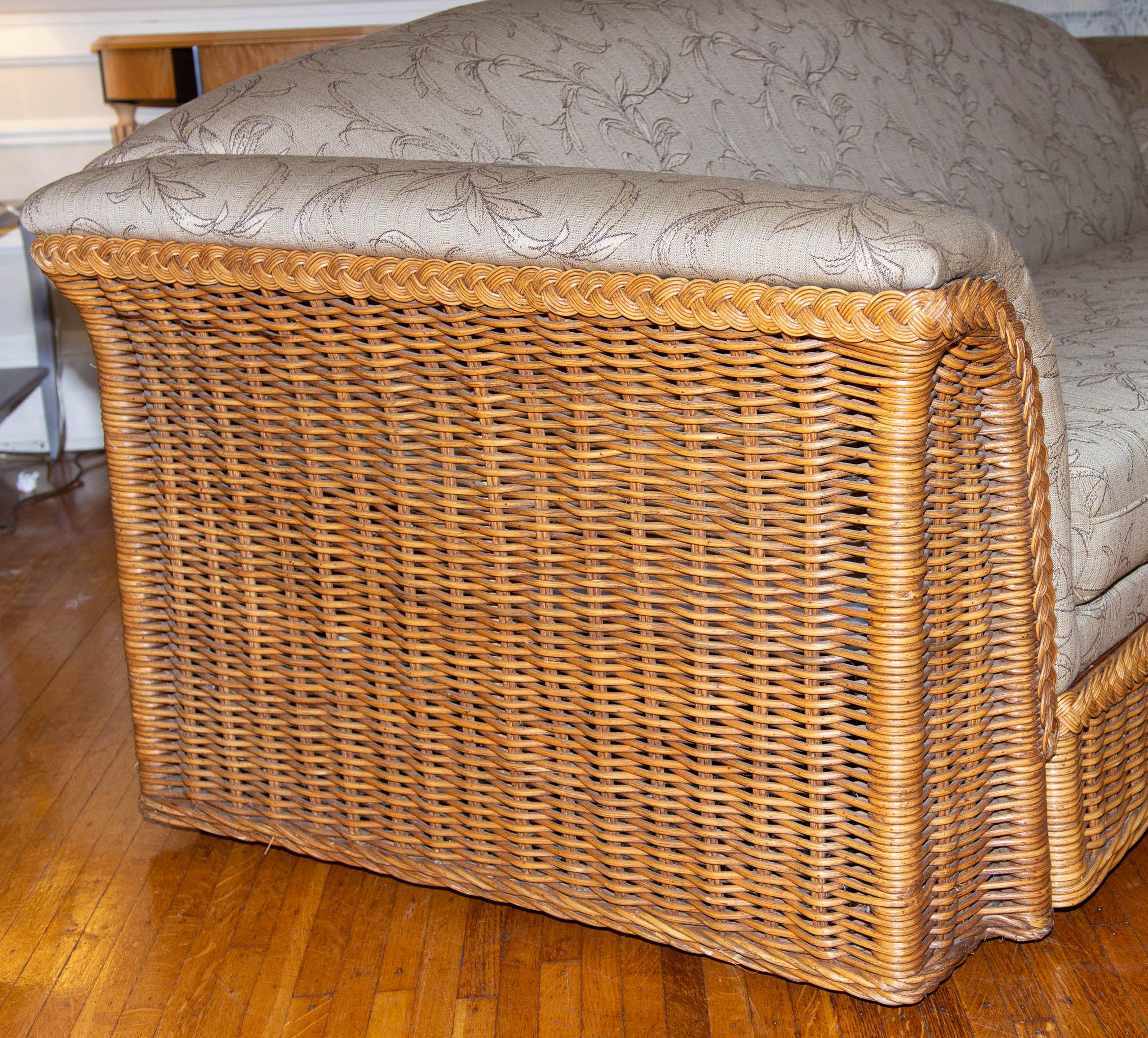 Modern upholstered wicker settee.  Please, contact us for shipping options.  Price is reduced and not negotiable.