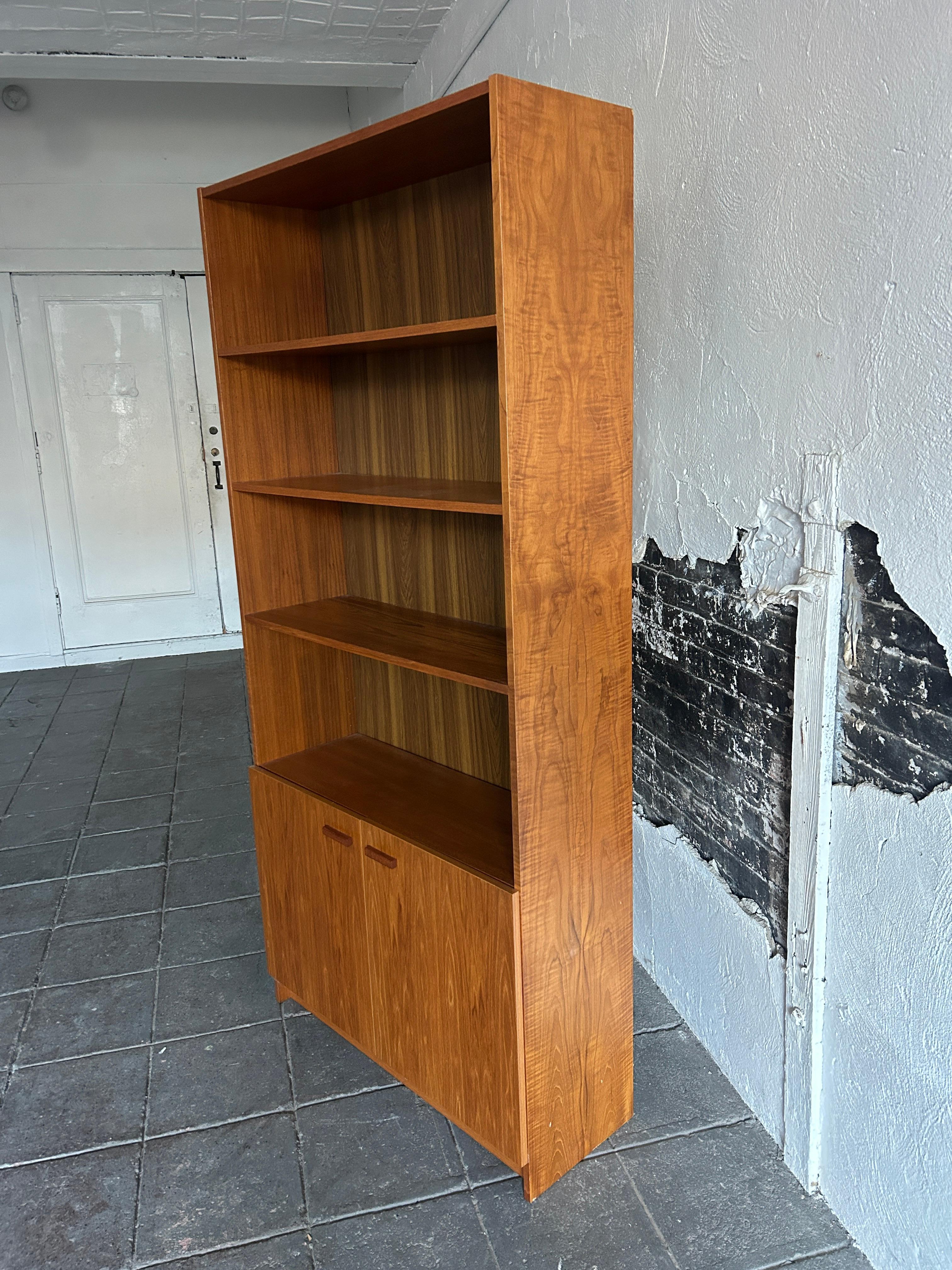 Danish Mid-Century Modern wide teak tall bookcase (2) cabinet doors Made in Denmark  For Sale