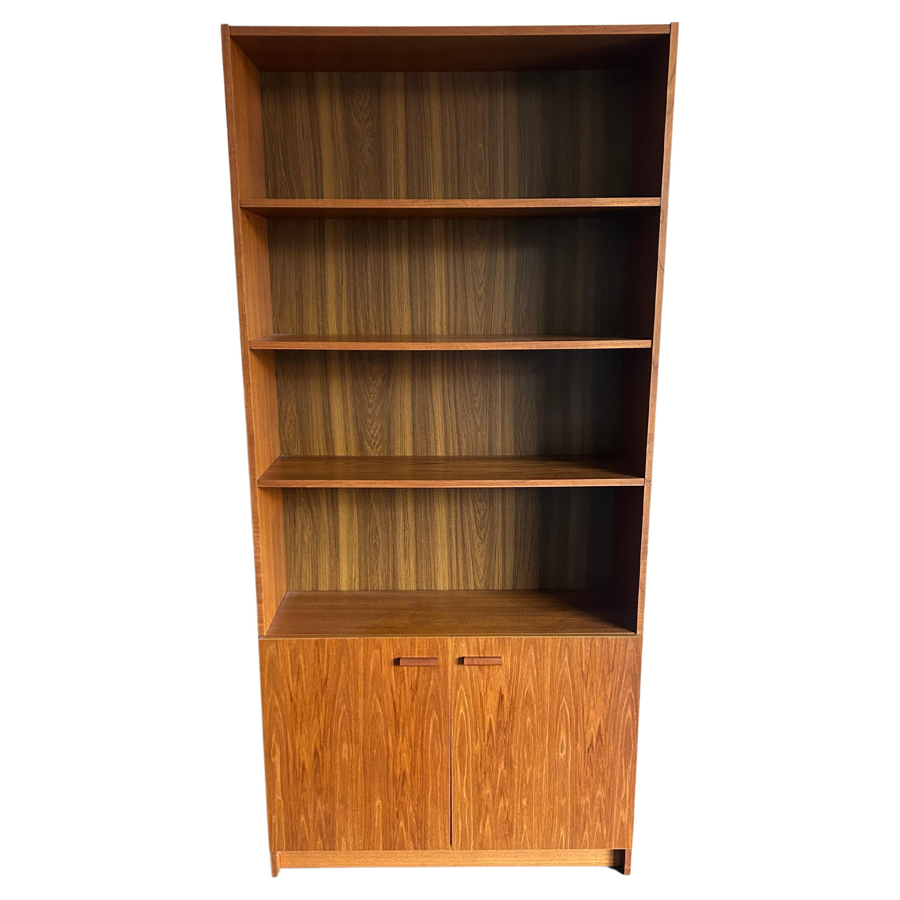 Mid-Century Modern wide teak tall bookcase (2) cabinet doors Made in Denmark  For Sale