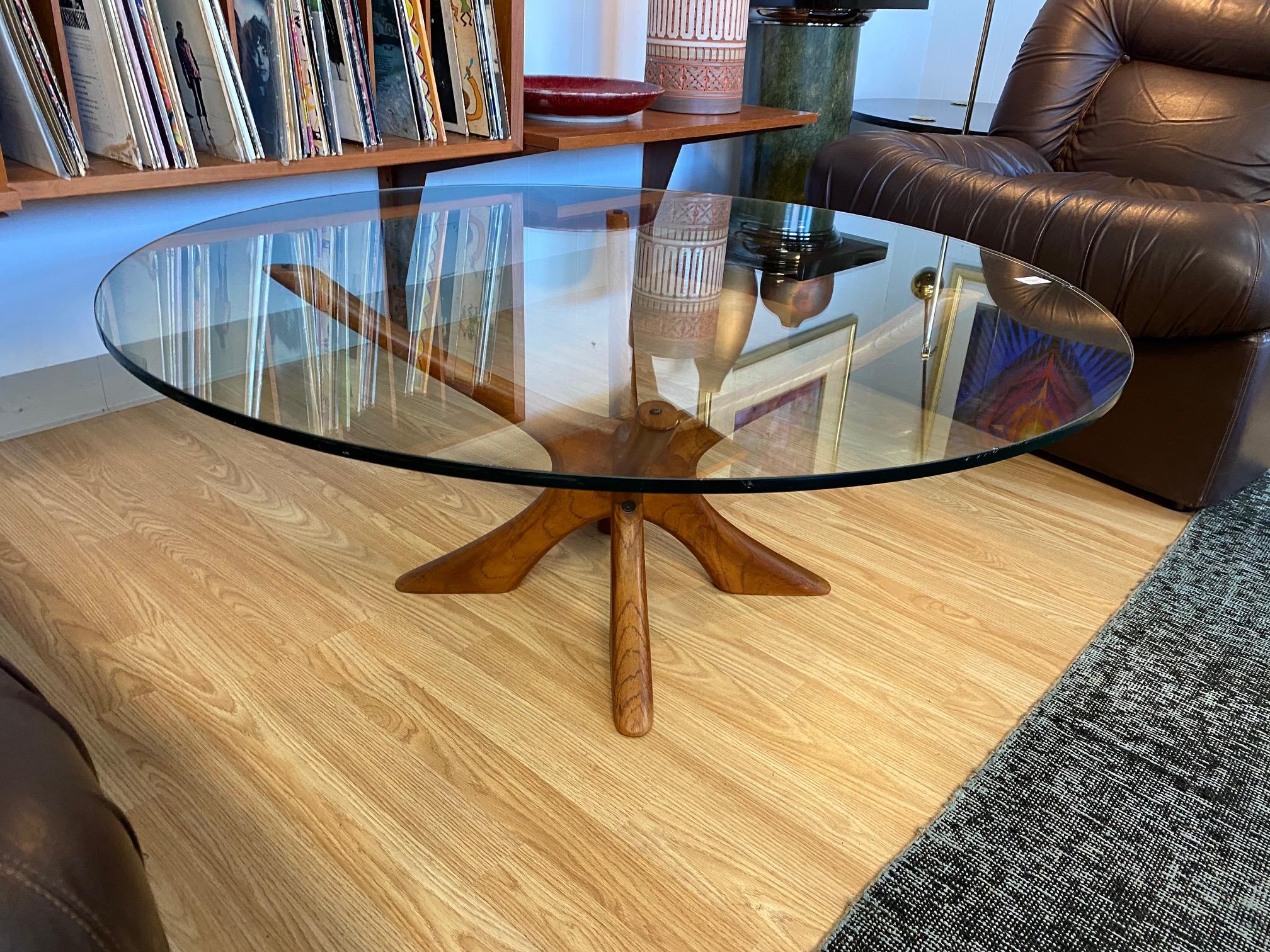 Beautiful sculptural coffee table made of teak designed by Illum Wikkelsø, circa 1960s, Denmark. Teak base is in great overall vintage condition; glass has two knicks featured in photos.
