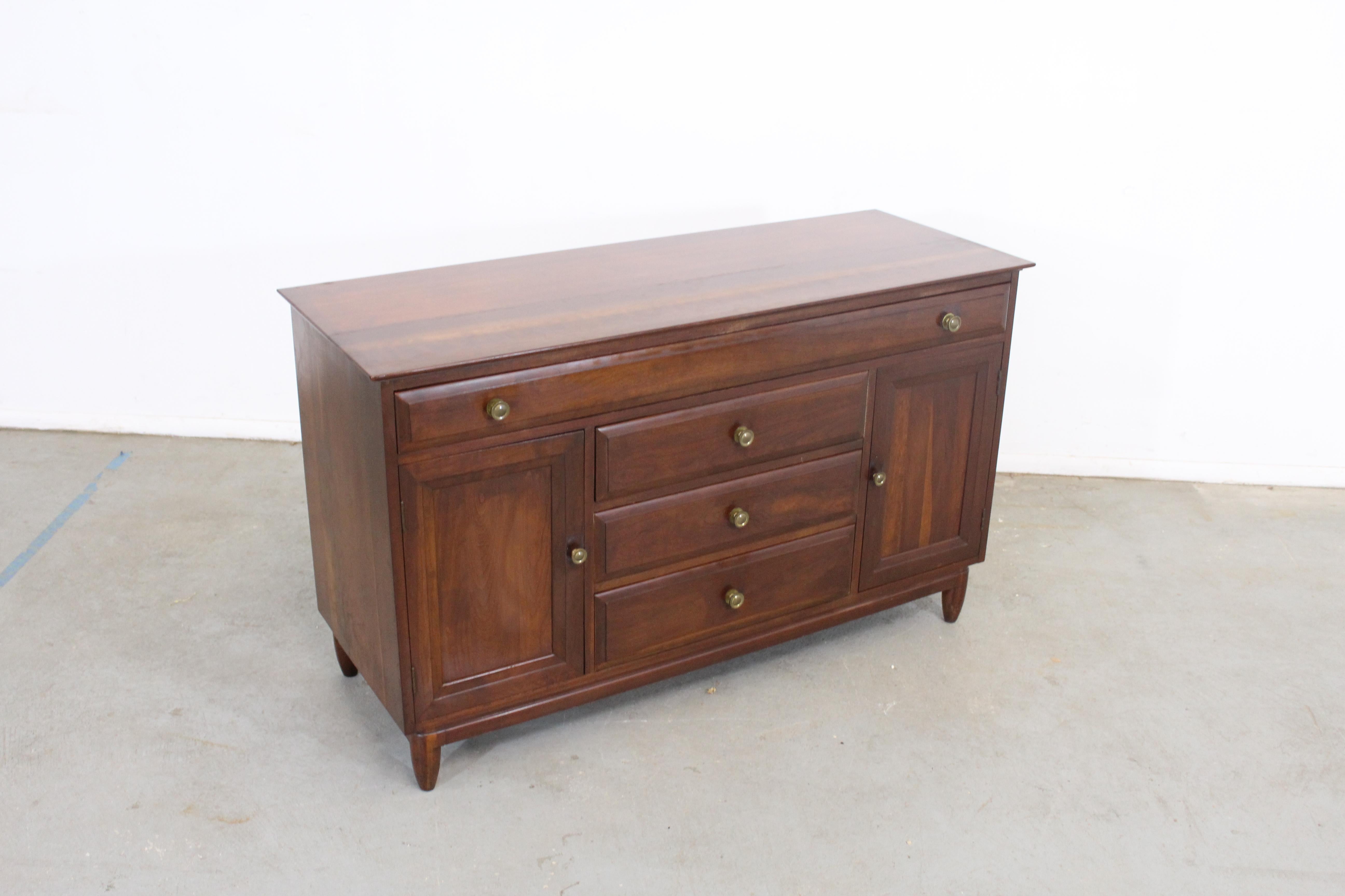 Mid-Century Modern Willett credenza/sideboard

Offered is a Mid-Century Modern Willett credenza/sideboard. Has 4 dovetailed drawers - one atop with rectangular framing on fronts and brass pulls, as well as three bottom drawers. It is in very good