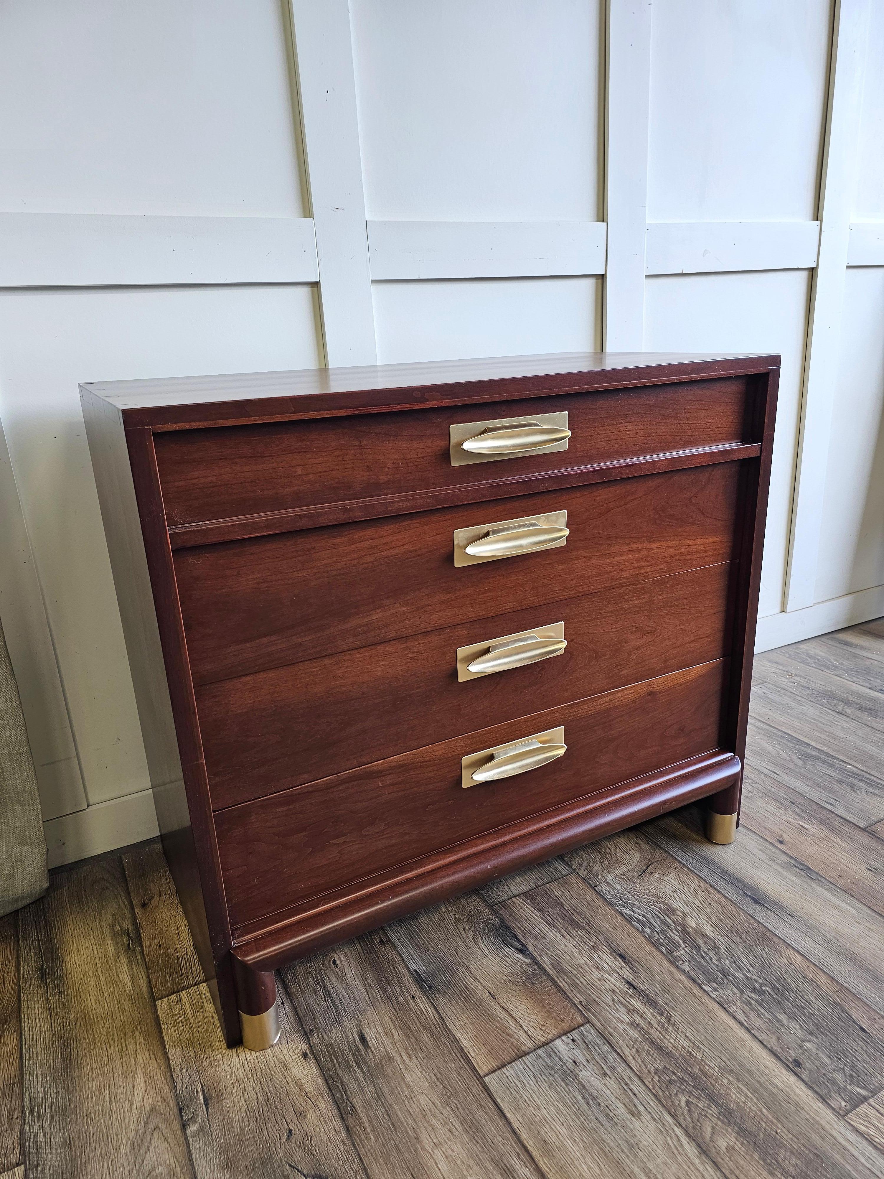 This exceptional Willett Furniture chest of drawers from the renowned Trans-East collection is a rare and distinguished piece, constructed entirely of solid cherry wood, with absolutely no veneer. A paragon of mid-century craftsmanship, this chest