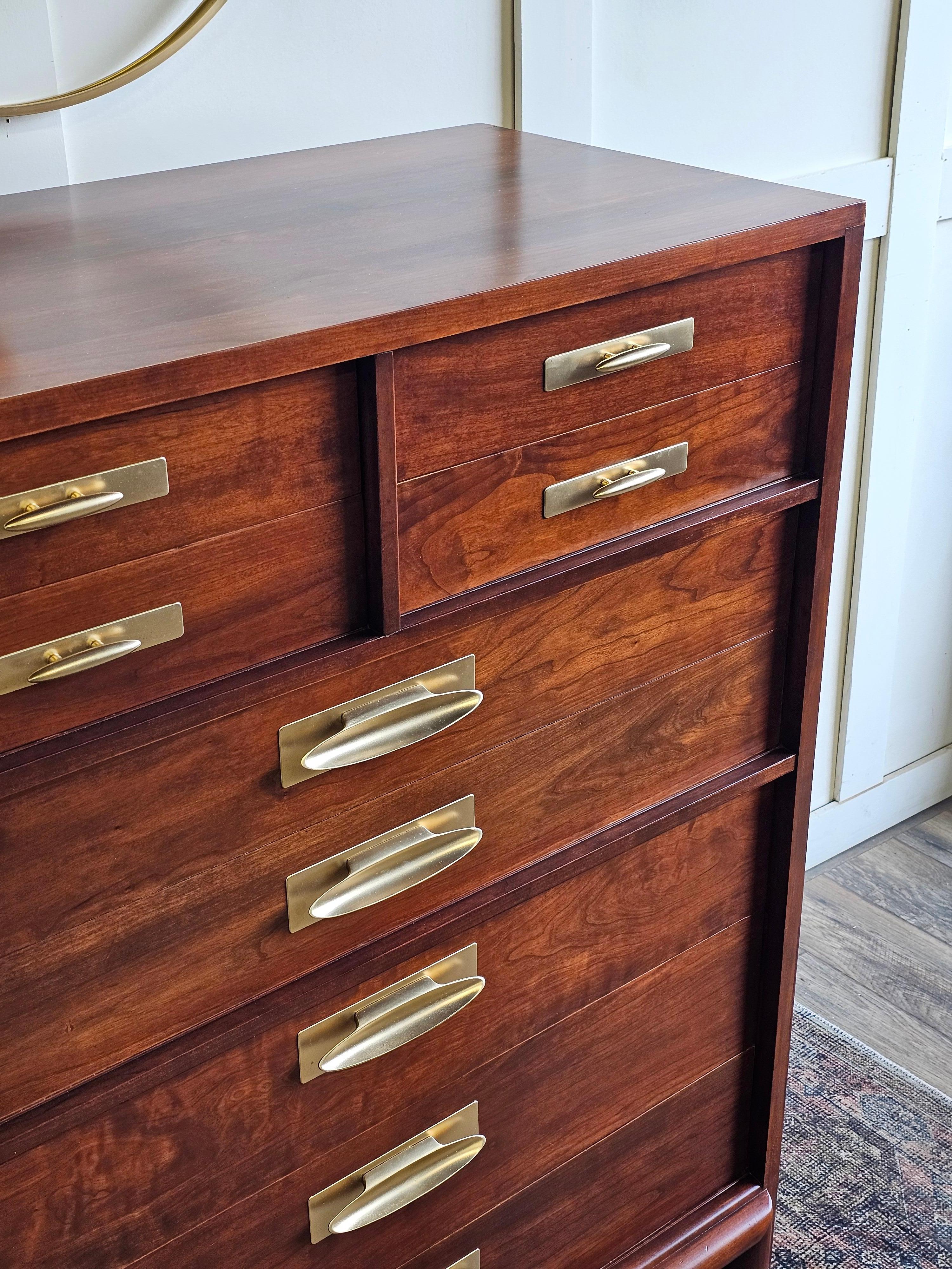 This exceptional Willett Furniture chest of drawers from the renowned Trans-East collection is a rare and distinguished piece, constructed entirely of solid cherry wood, with absolutely no veneer. A paragon of mid-century craftsmanship, this chest