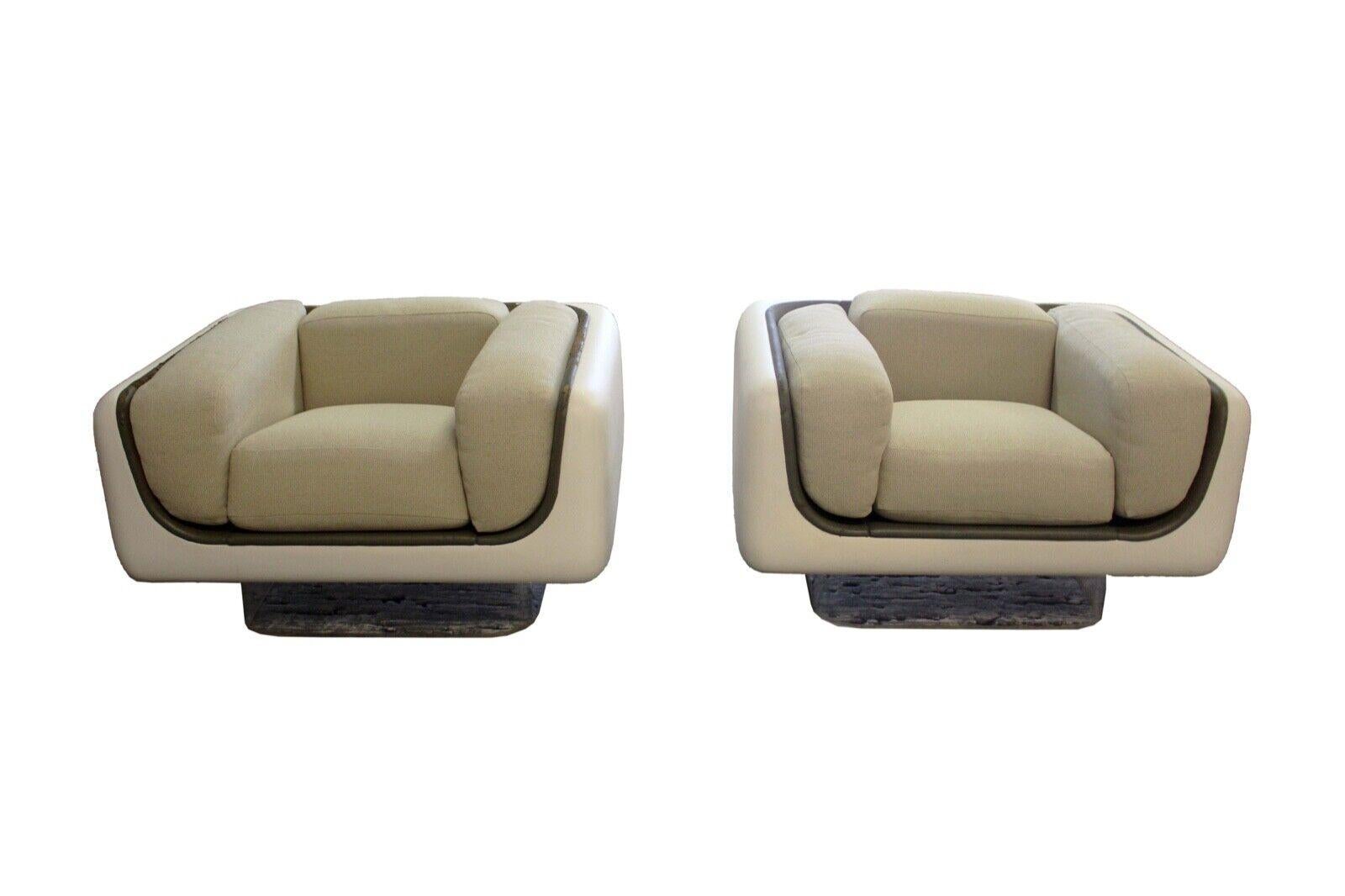 We present this rare pair of by William Andrus for Steelcase, chic and cool, fiberglass floating chairs on lucite base . Matching sofa also available in a separate post. The set is in great condition except for the inside leather trim of the chairs.