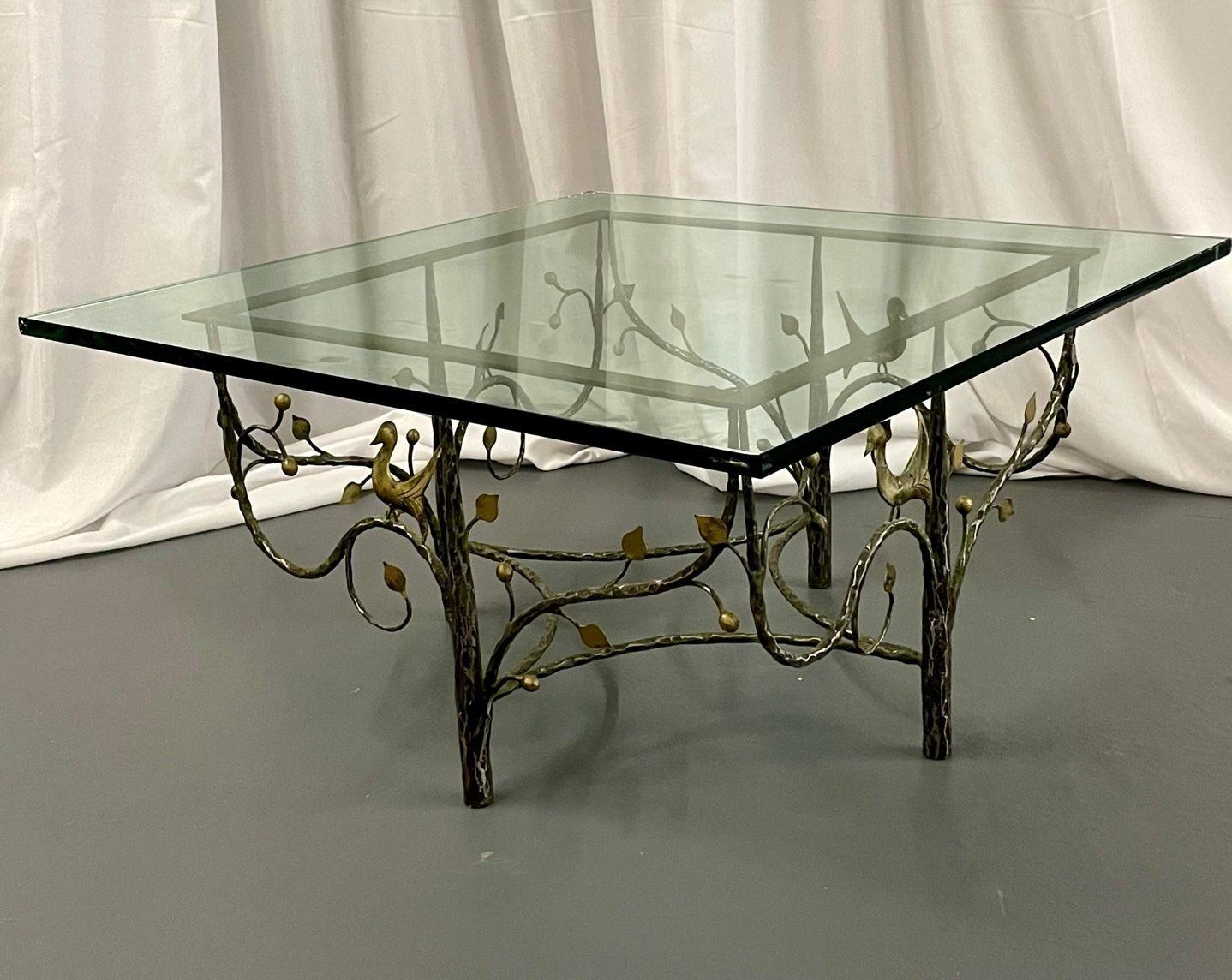 Mid-Century Modern William Switzer square coffee table, wrought iron, glass.
 
Unique Wrought Iron coffee table with an intricately detailed base having a Fall/Spring Motif. The iron base depicts scenes of birds and leaves. The table is finished