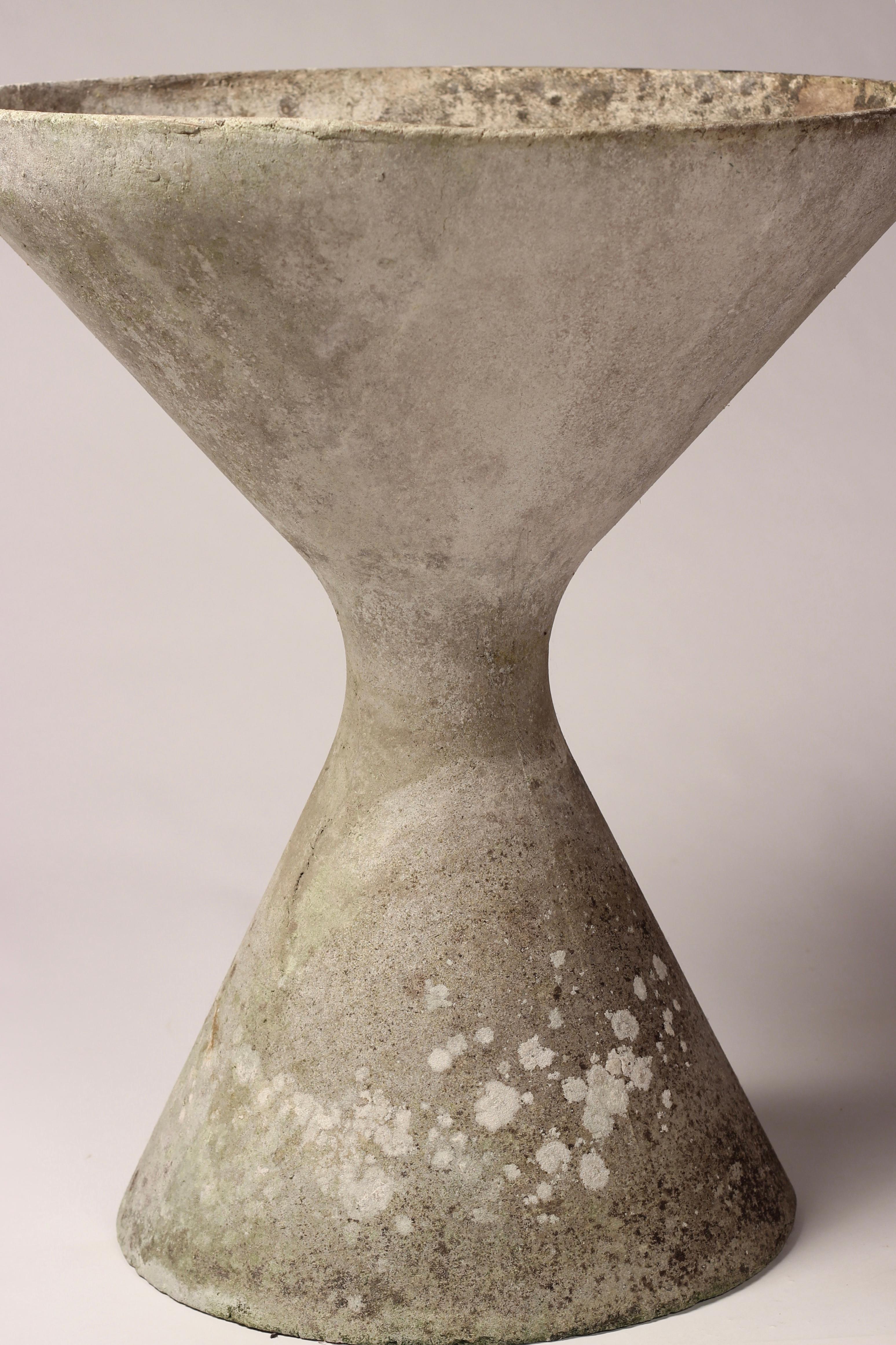 Showing close to 60’s year of Patina, this wonderful example of a concrete Hourglass planter has improved in character with age. Perfect for sculptural or trailing plants, indoors or outdoors. It also be inverted to give you a second option for a