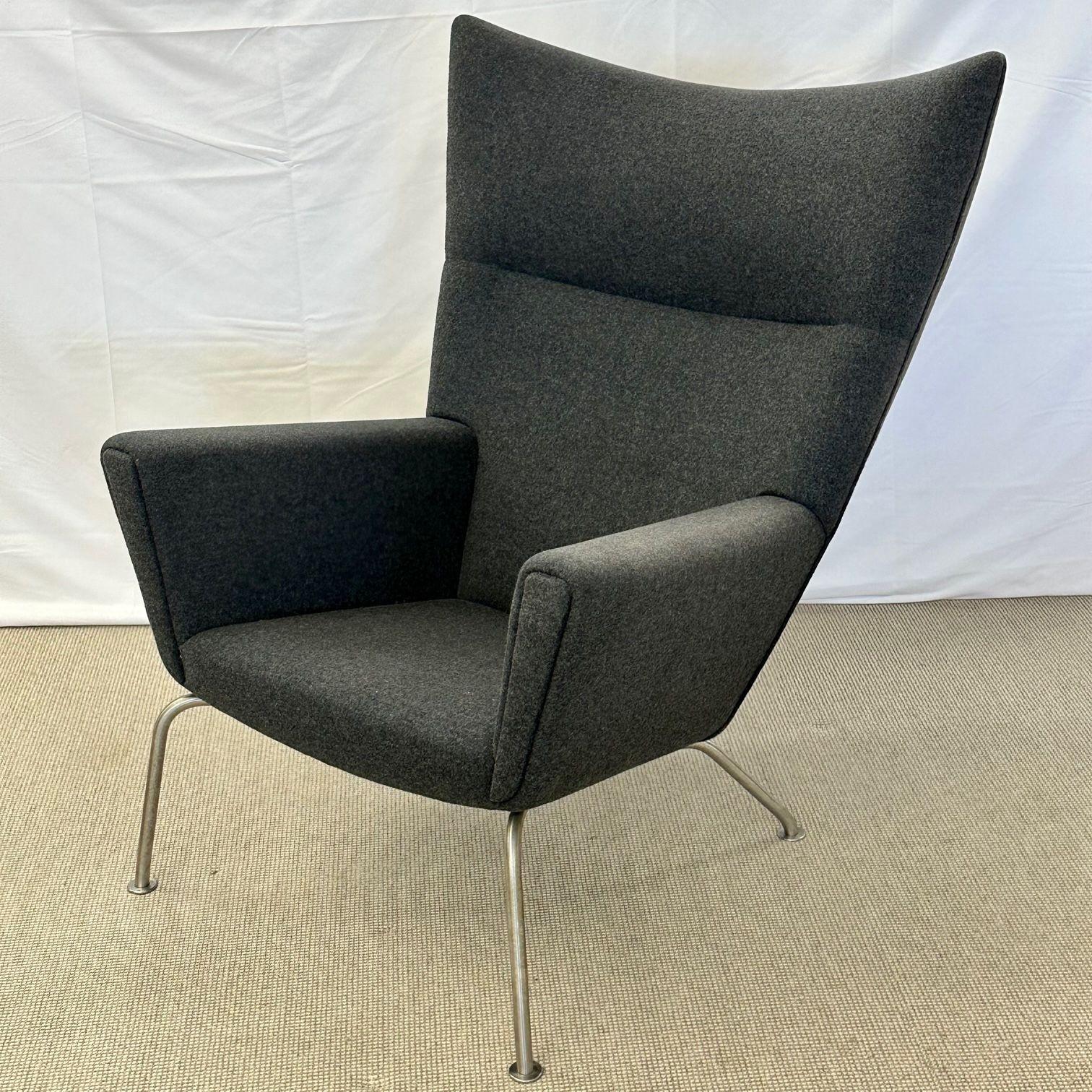 
 Mid-Century Modern Wing / Lounge Chair by Hans Wegner for Carl Hansen, Labeled

Hans Wegner for Carl Hansen & Son Wing Chair, Model Ch445. Iconic lounge chair having a famous 'Ox' chair inspired stainless steel base with an organic form high