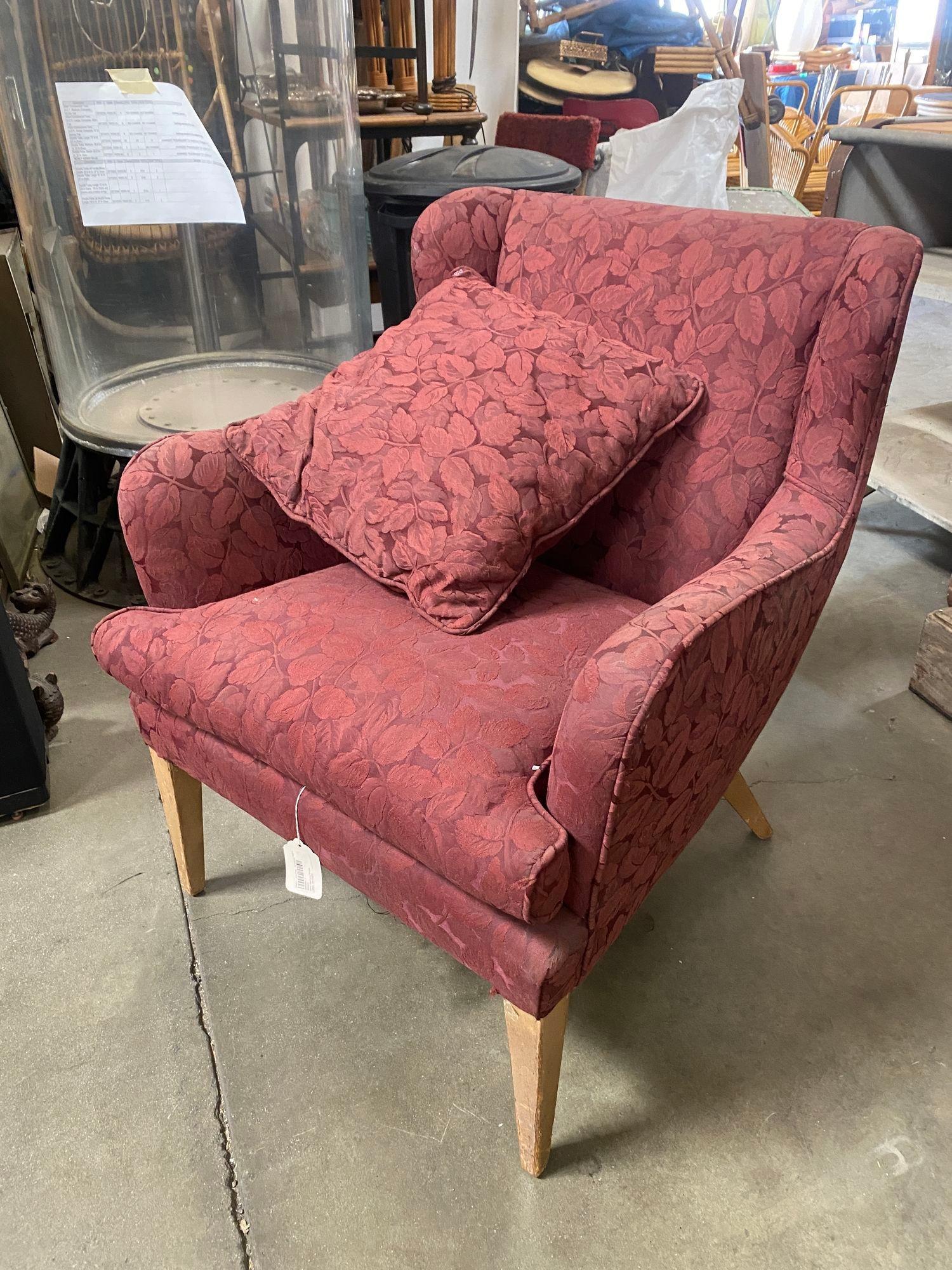 The Burgundy Wingback Mid-Century Chair is a spacious, stylish blend of vintage and modern design. With its rich burgundy upholstery, curved backrest, and tapered wooden legs, it complements any room.

Pair of 2.

Measures:
Chair H 31 in. x W 35 in.