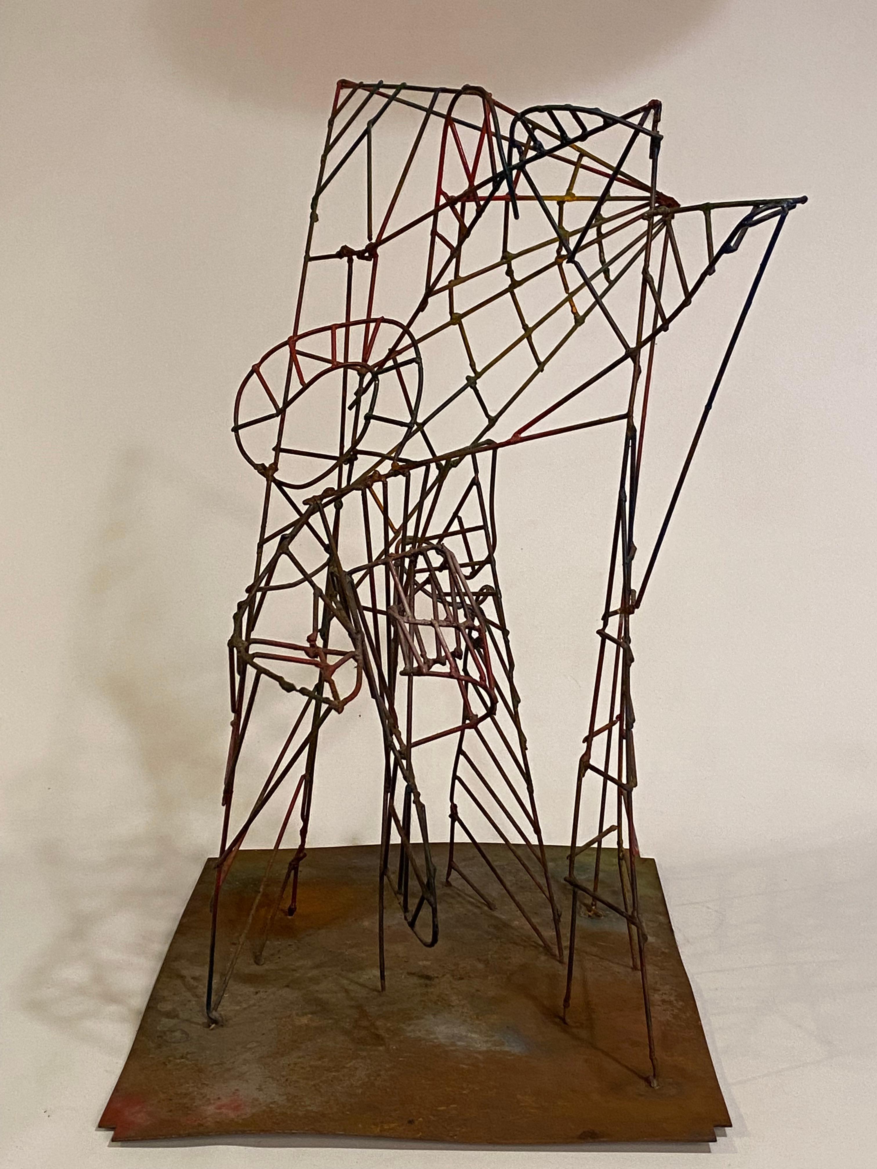 An amazing spider's web of a rollercoaster of design and line. This sculpture is just as delicate and light filled like a spider's web. A work that reaches, careens, and zigzags Constantly changing maze of line and perspective. Comprised of welded