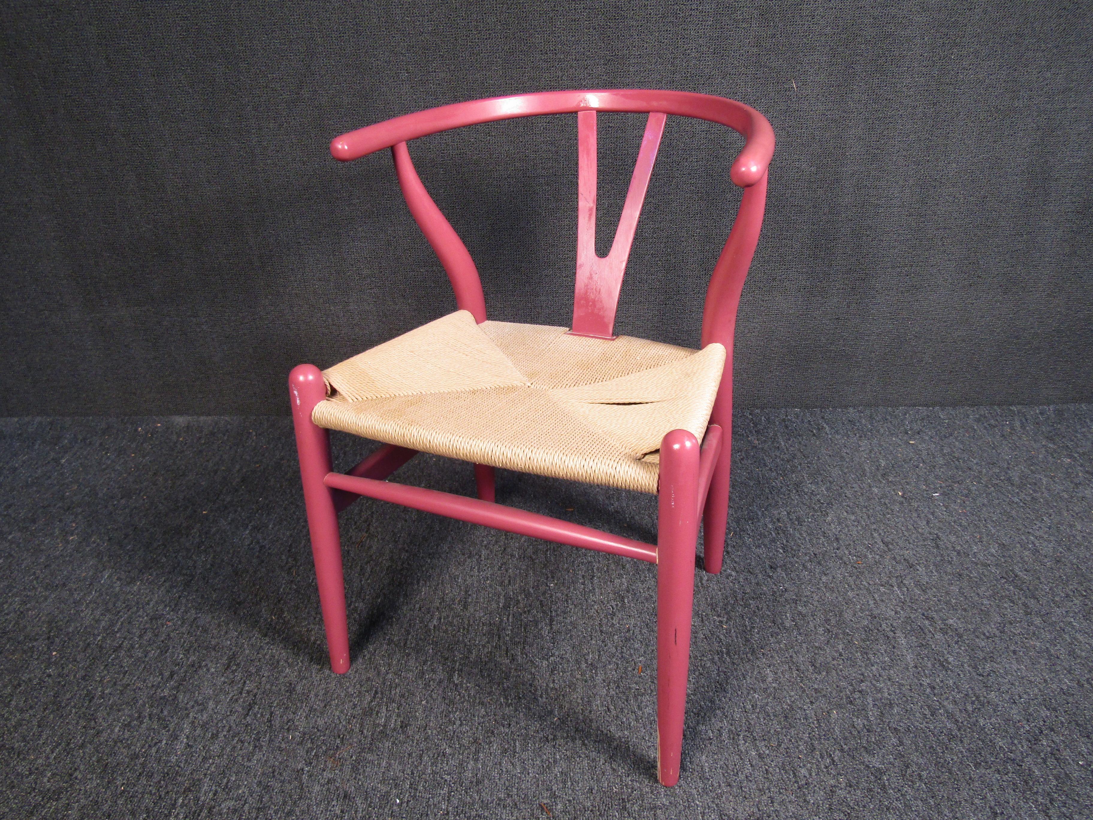 A colorful and unique chair styled after Hans Wegner's iconic Wishbone design. This chair is full of Mid-Century Modern style and is sure to brighten up any space. Please confirm item location with seller (NY/NJ).