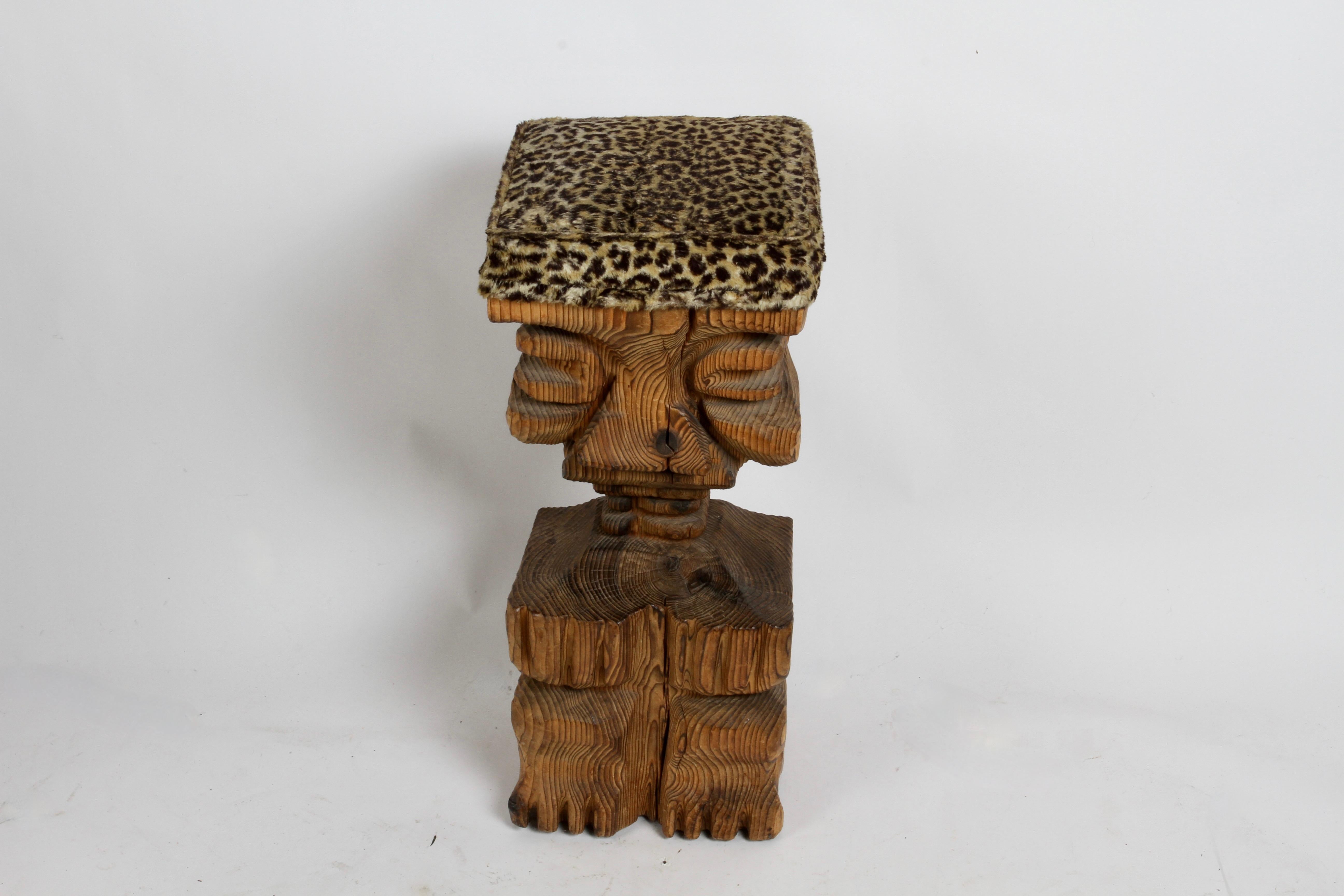 Single Mid-Century Witco Tiki barstool - tribal sitting figure with carved face and original faux leopard upholstery designed by William Westenhaver. In nice original condition, no damage noted to wood. Upholstery shows wear. 



In 1958, a small
