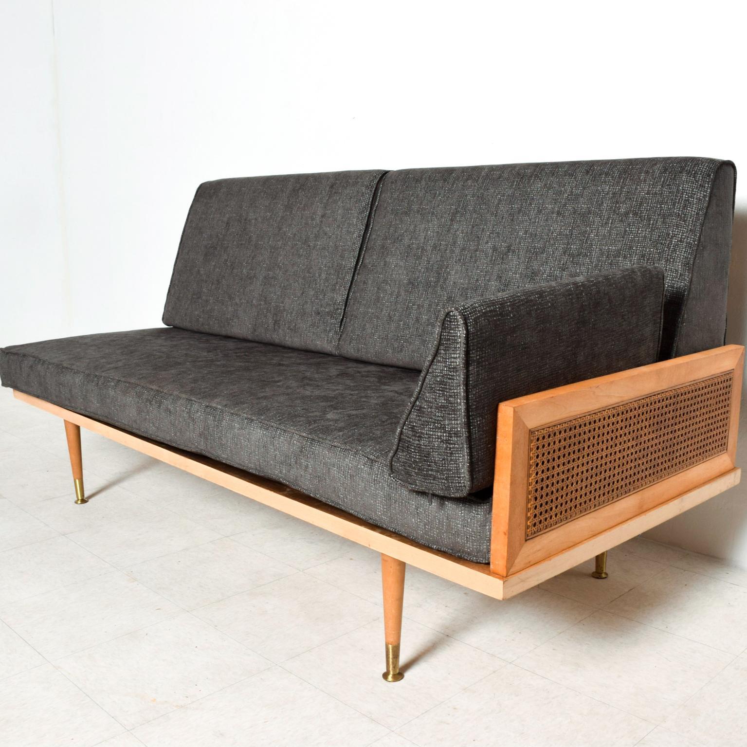 We are pleased to offer for your consideration a beautifully modern set of daybeds or matching sofas. Solid maple wood with tubular steel hardware in black paint. Armrest decorated with wicker cane. Mounted on solid maple wood peg legs with brass