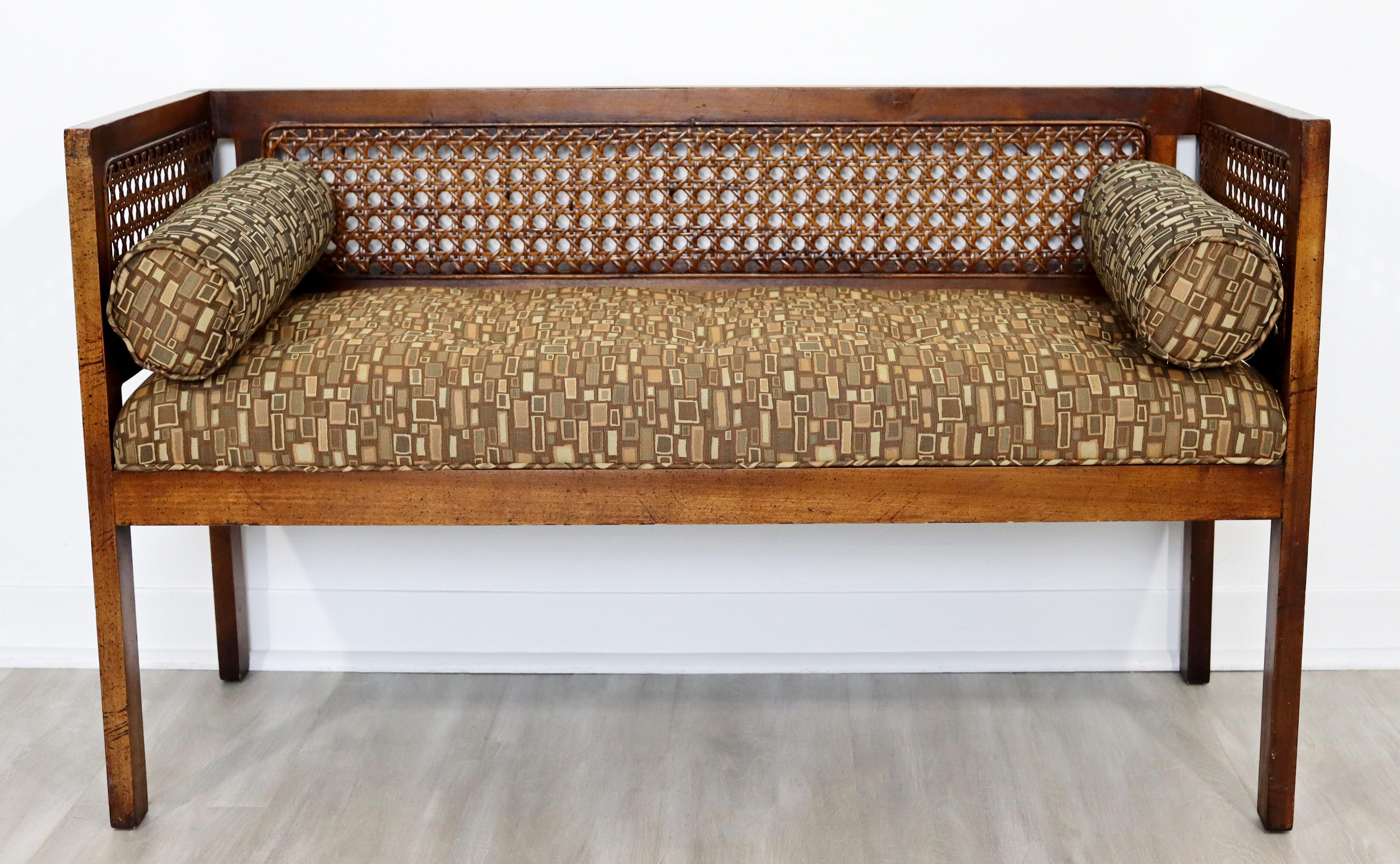 For your consideration is a classic bench seat, made of wood and with a rattan cane back, circa the 1950s 1960s. In excellent vintage condition. The dimensions are 43.5