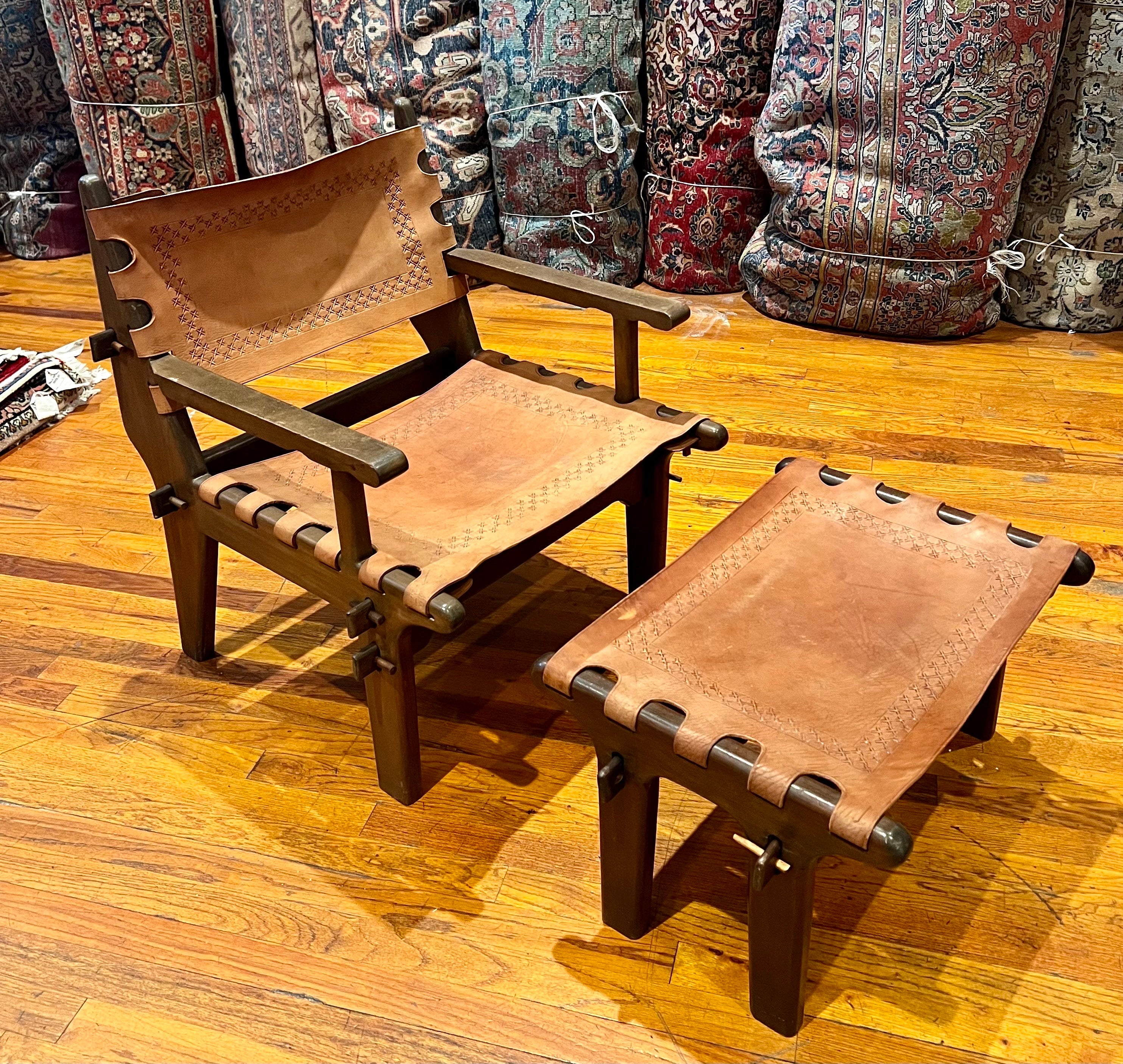 
Beautiful aesthetically captivating this stunningly unique mid-century modern lounge armchair and ottoman by Ecuador’s Angel Pazmino is the epitome of functional art. Crafted by artisans from tropical hardwoods with hand-tooled leather slings this