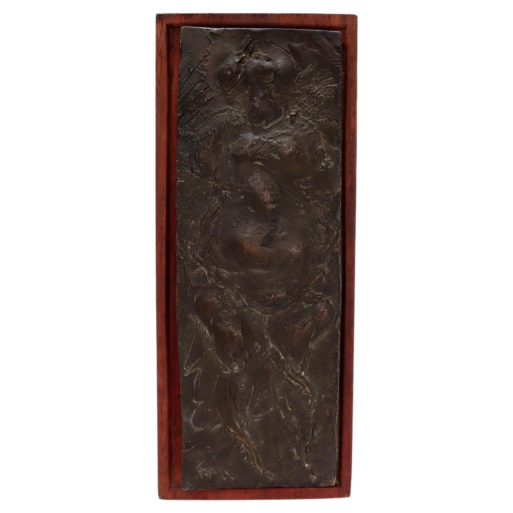 American Mid-Century Modern Wood Mounted Bronze Plaque of a Rotund Woman signed Fane For Sale