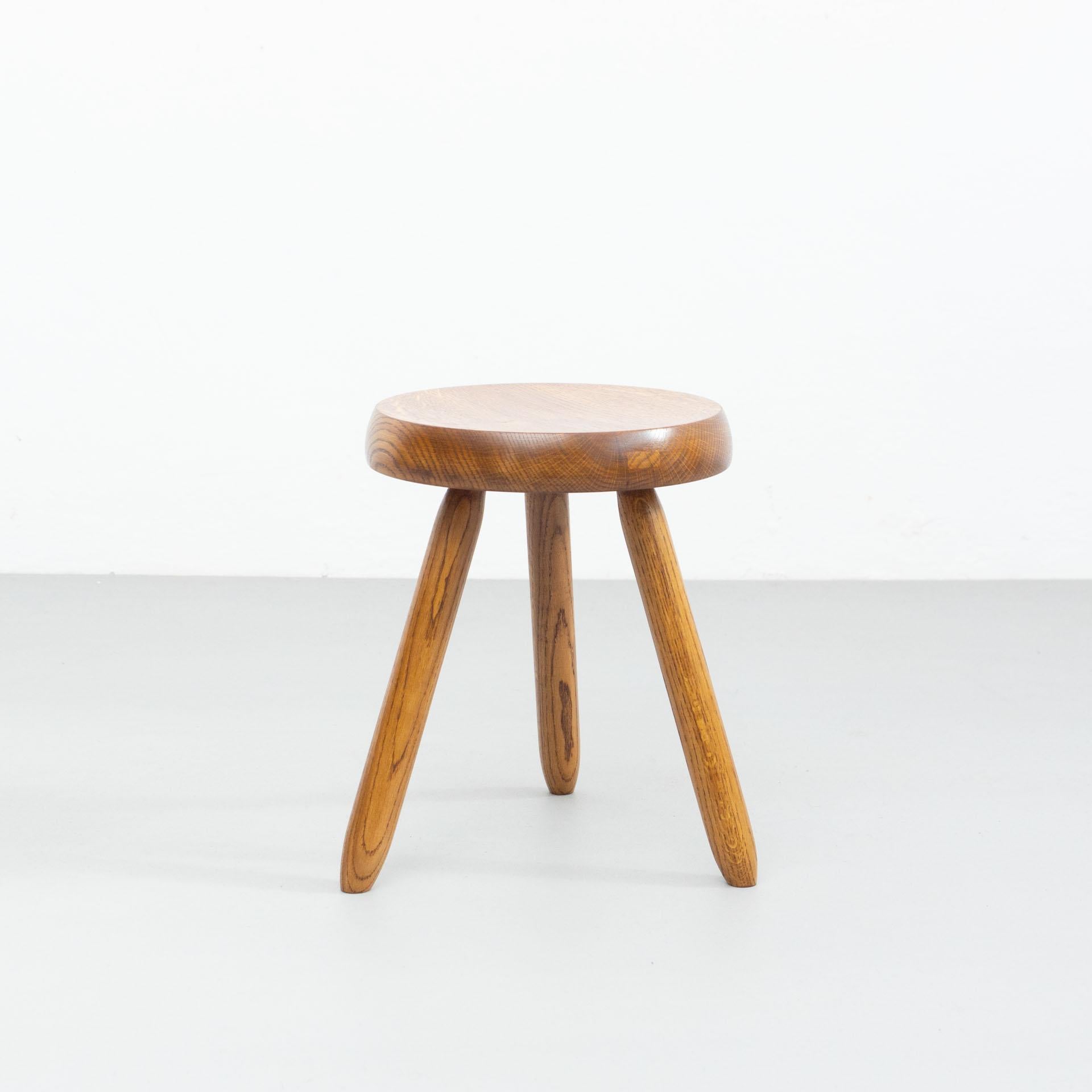 Set of three stools designed in the style of Charlotte Perriand.
Made by unknown manufacturer.

In good original condition, preserving a beautiful patina, with minor wear consistent with age and use. 

Materials:
Wood

Dimensions:
ø 32 cm x