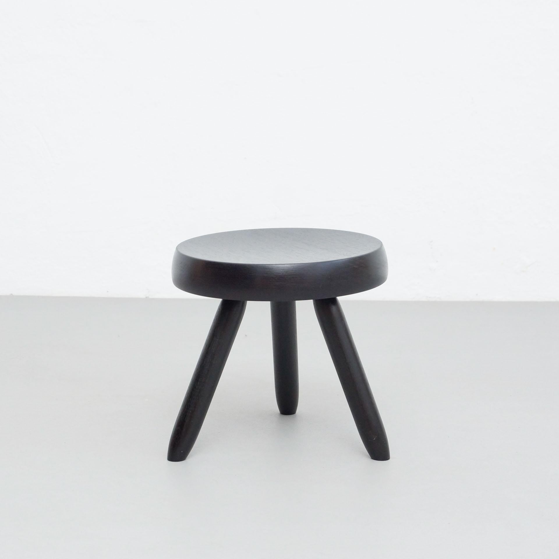 Stool designed in the style of Charlotte Perriand.
Made by unknown manufacturer.

In good original condition, preserving a beautiful patina, with minor wear consistent with age and use. 

Materials:
Wood

Dimensions:
ø 31.5 cm x H 30