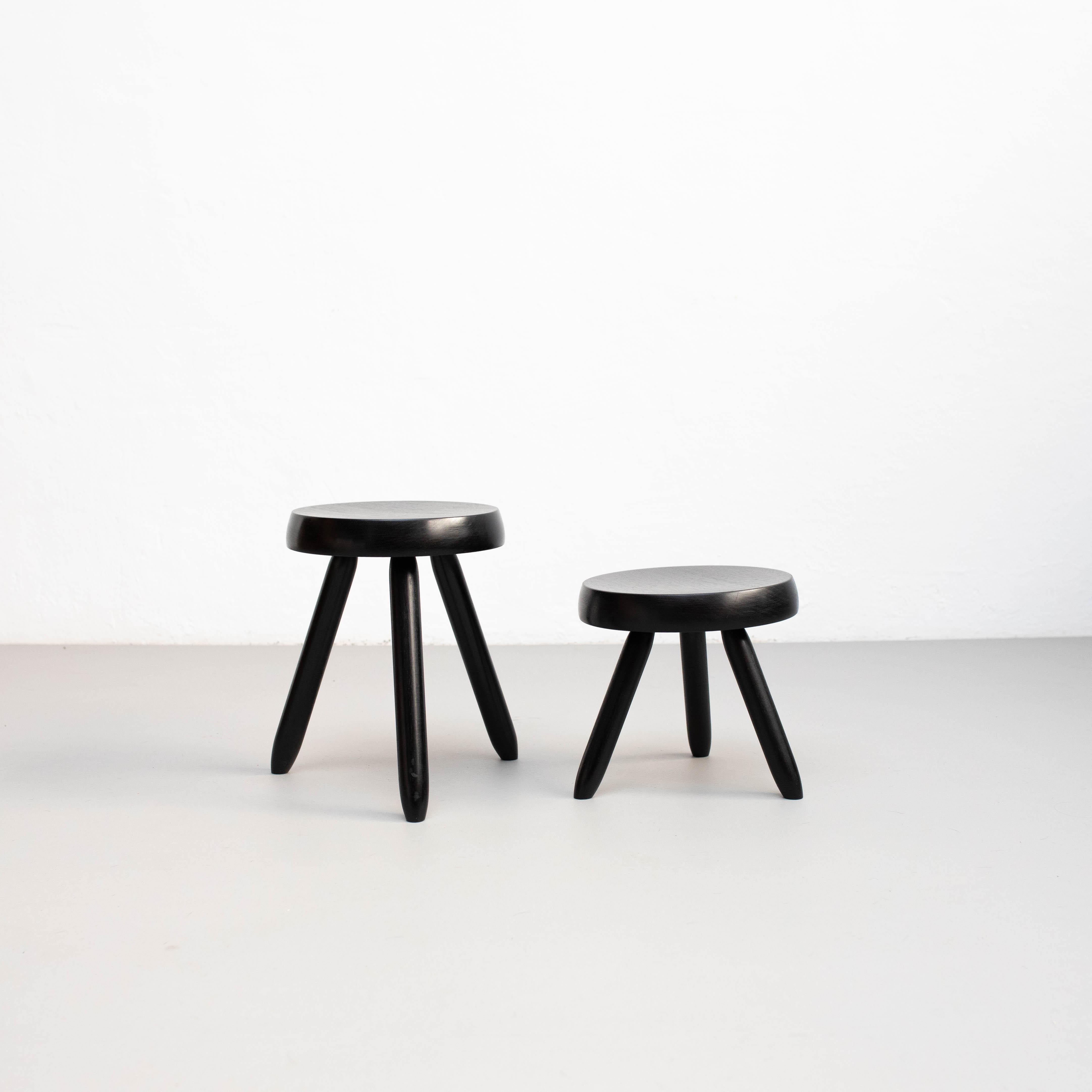 Stools designed in the style of Charlotte Perriand.
Made by unknown manufacturer.

In good original condition, preserving a beautiful patina, with minor wear consistent with age and use. 

Materials:
Wood

Dimensions:
1-                    2-
H 15.5