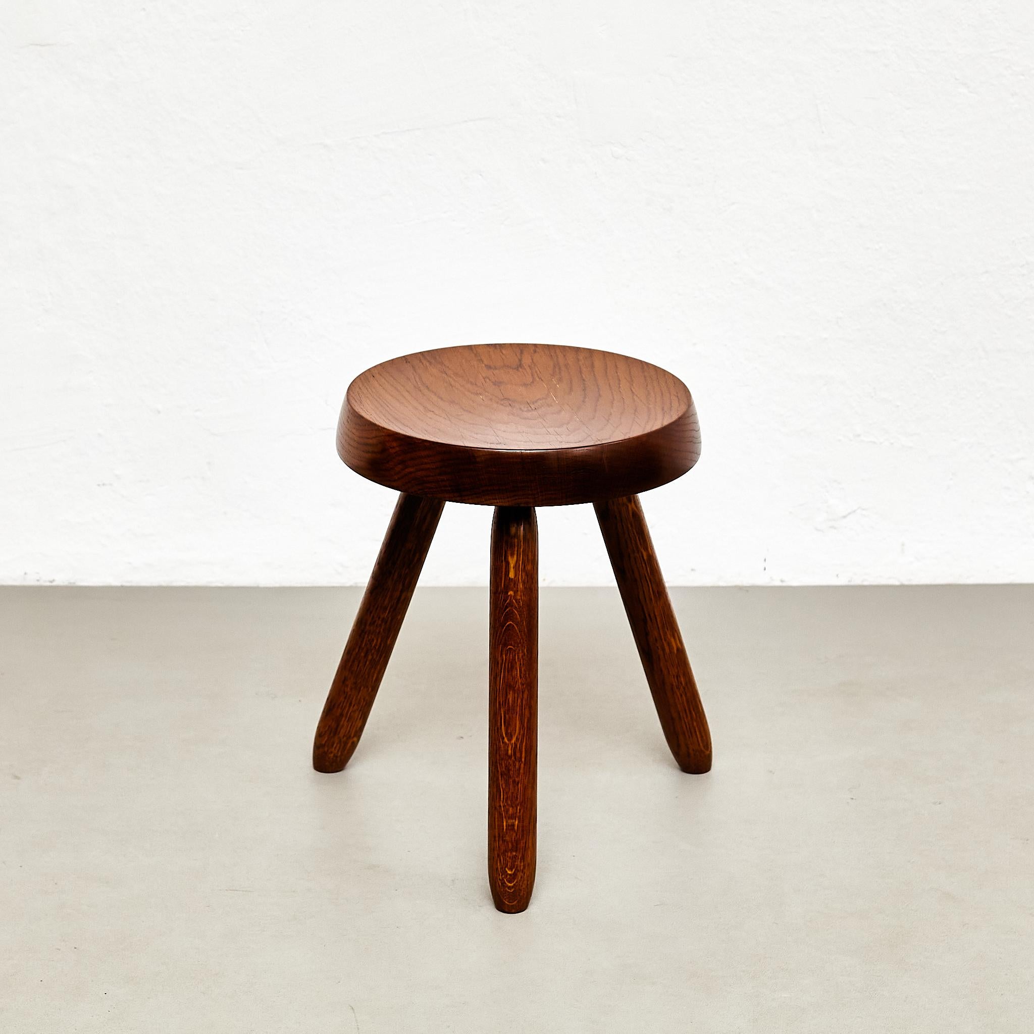 Stool designed in the style of Charlotte Perriand.
Made by unknown manufacturer.

In good original condition, preserving a beautiful patina, with minor wear consistent with age and use. 

Materials:
Wood

Charlotte Perriand (1903-1999) She was born