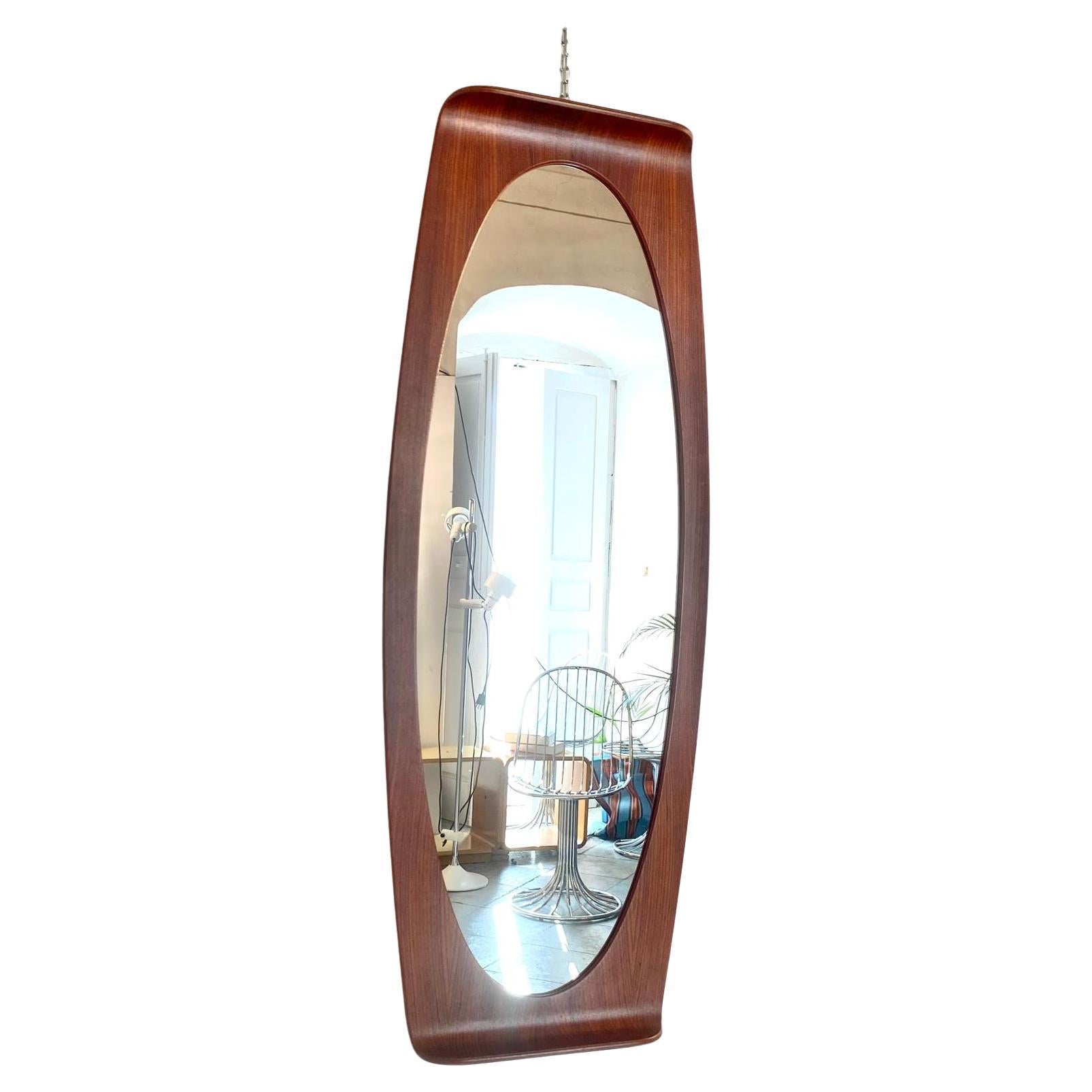 Mid Century Modern Wood Wall Mirror, Campo e Graffi, Italy 1950s

Large oval curved mirror with a rosewood frame, manufactured in Italy in the 1950s and designed by the renowned duo Campo & Graffi for Stilcasa Italia.

This elegantly designed piece
