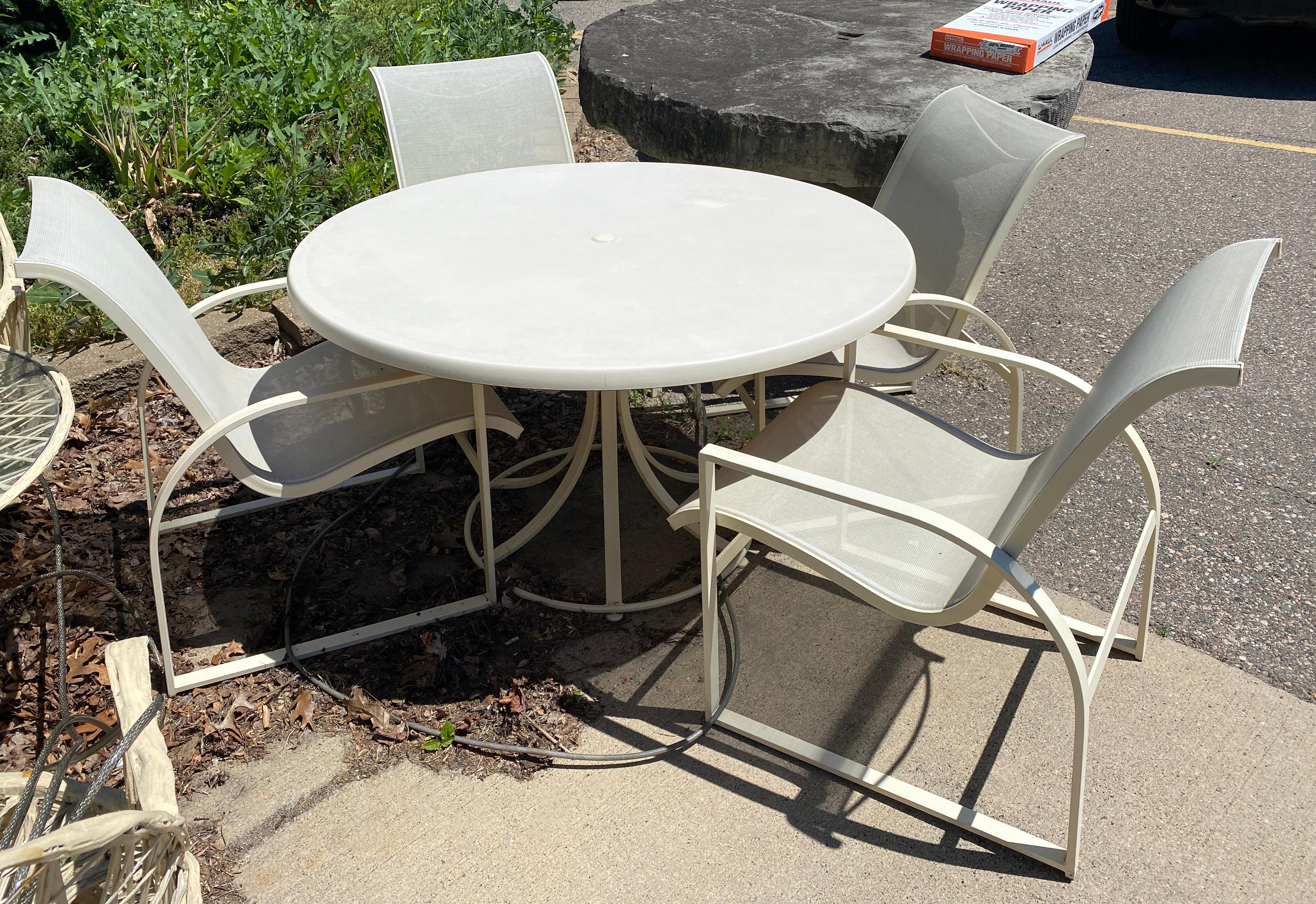 For your consideration is a phenomenal outdoor patio set of four Margaraita patio chairs and matching dining table, by Russell Woodard, circa 1960s. In very good vintage condition. The dimensions of the chairs are 23.5