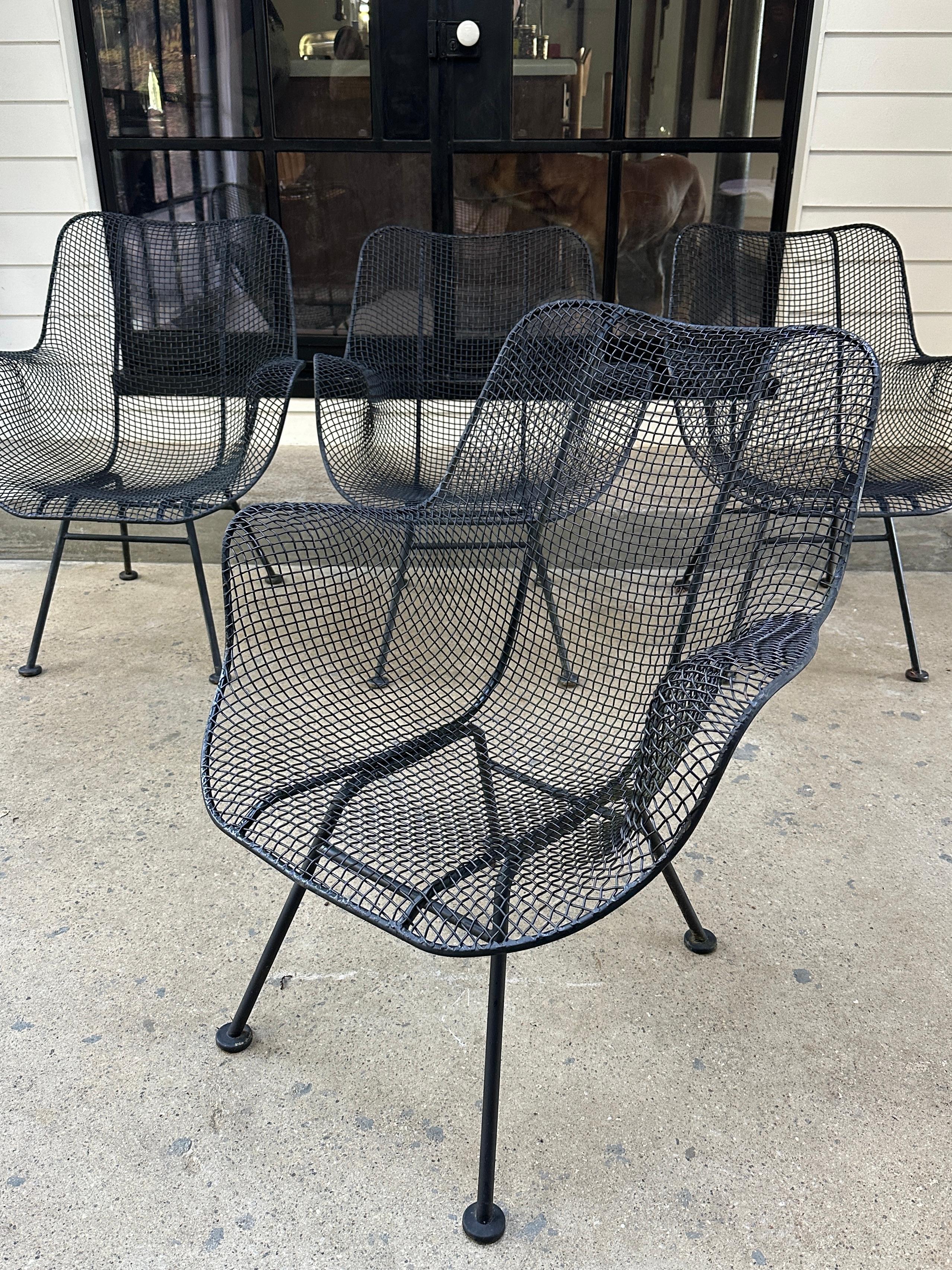 1950s Russell Woodard Sculptura set in black steel mesh and iron. No bends or breaks in the wire mesh. For indoor or outdoor use.

26.5”W x 26.5”D x 31.5”H x 14.5”SH x 24”Arm H

Price is per set of 4. 