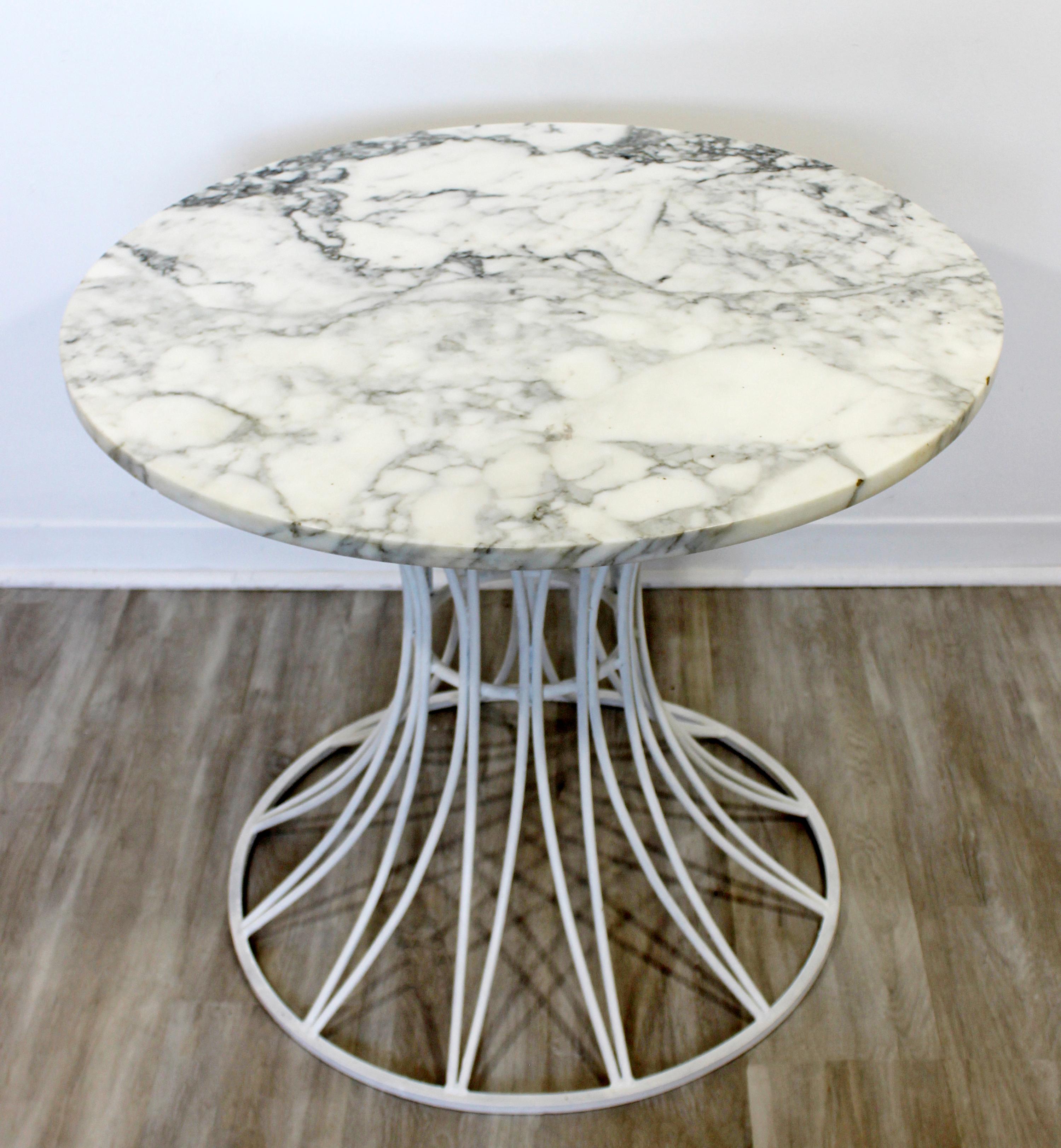 For your consideration is a gorgeous, outdoor patio table, with a marble top, by Russell Woodard, circa 1960s. In very good vintage condition. The dimensions are 32