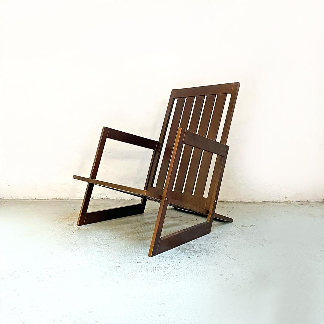 Mid-Century Modern wooden armchair with parallel salts structure, 1980s
Wooden armchair with parallel slats structure on the inclined seat and backrest, squared armrests of irregular shape.

Very good condition.

Measurements 80x66x84h cm.