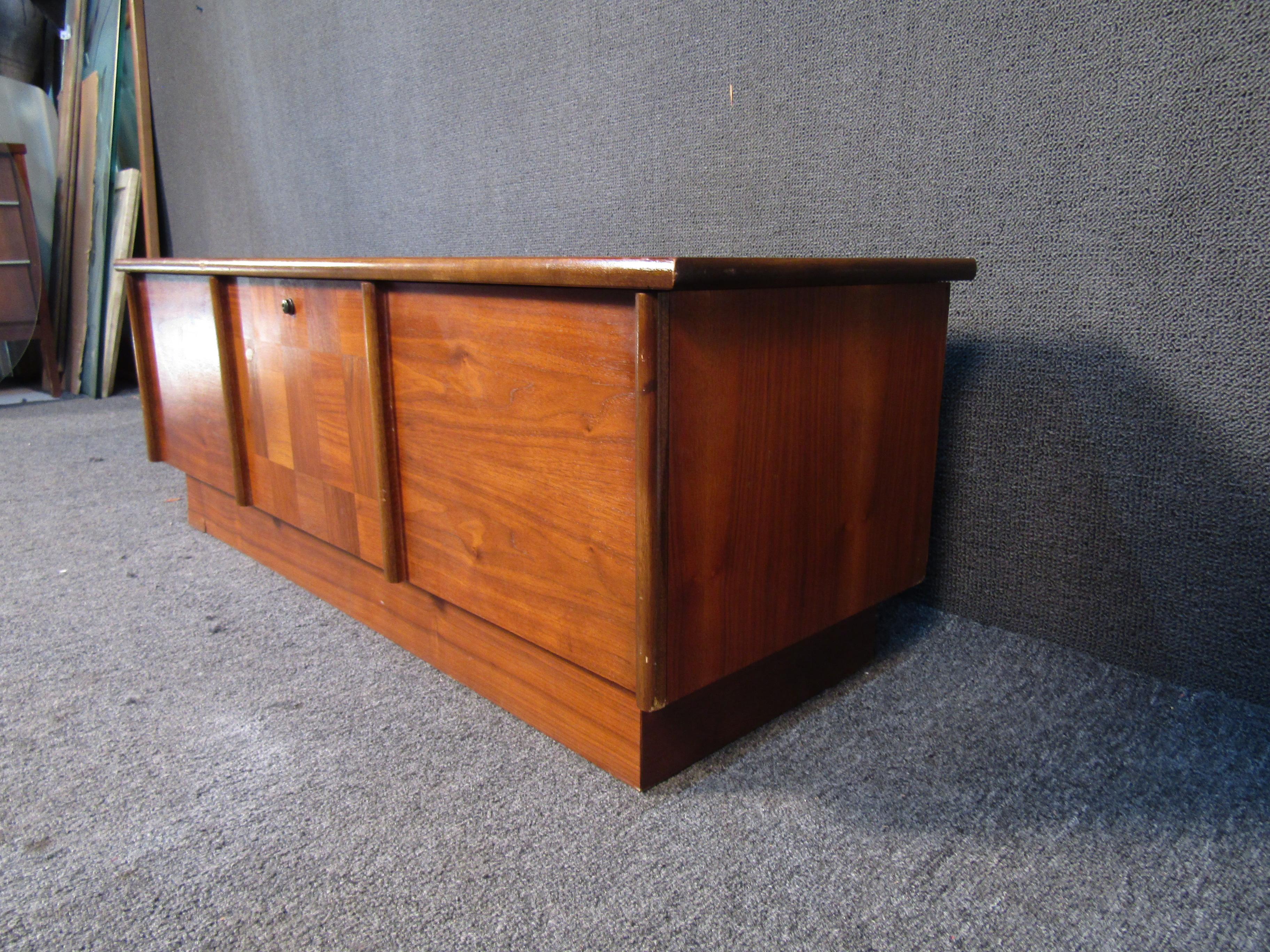 This vintage wooden chest by Lane is a tasteful and quality piece of Mid-Century Modern design. Rich woodgrain adds timeless style to any space, along with plenty of storage inside. Please confirm item location with seller (NY/NJ).